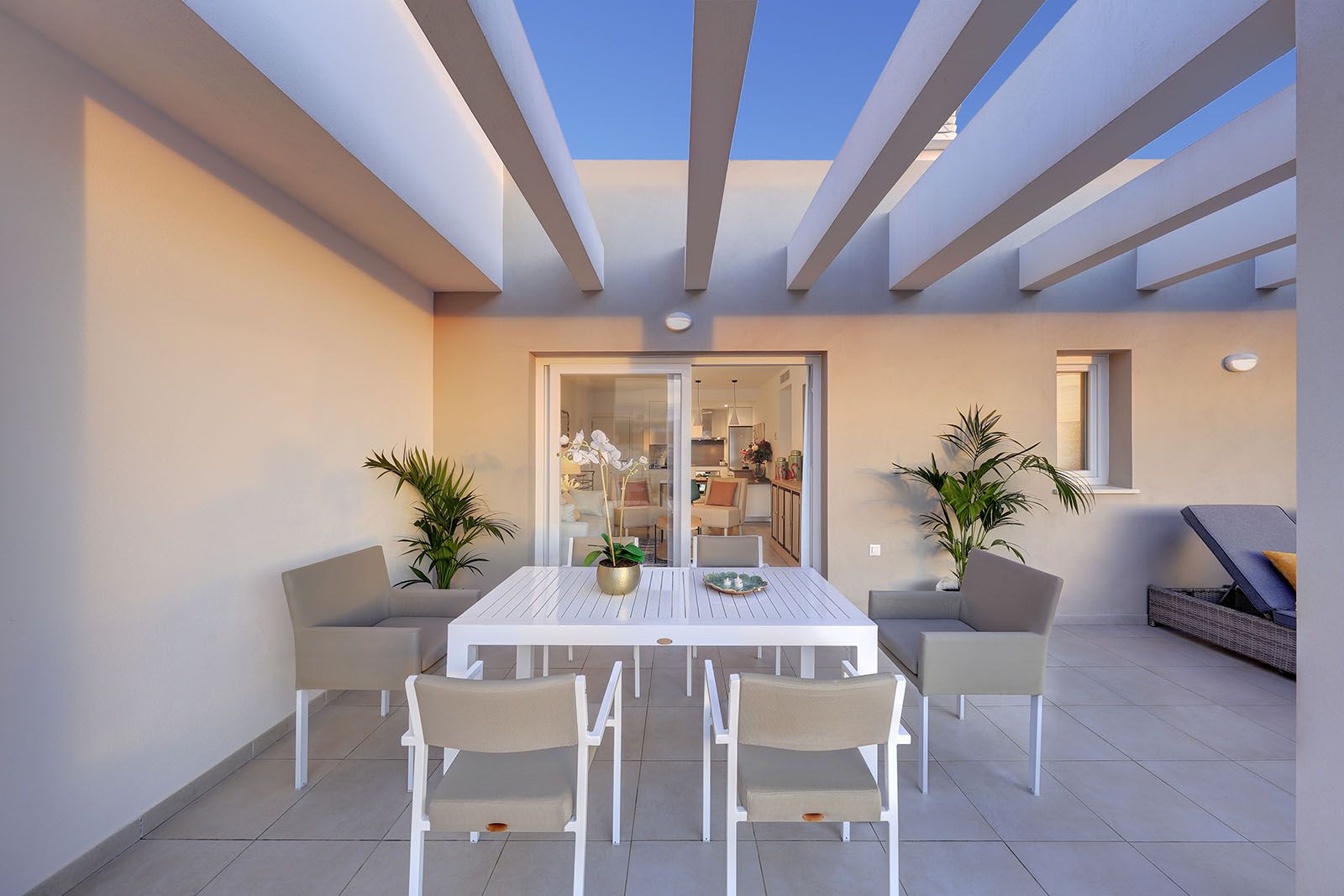 Living area with glazed doors leading to terrace in penthouse, Rodeo Alto-Guadaiza-La Campana