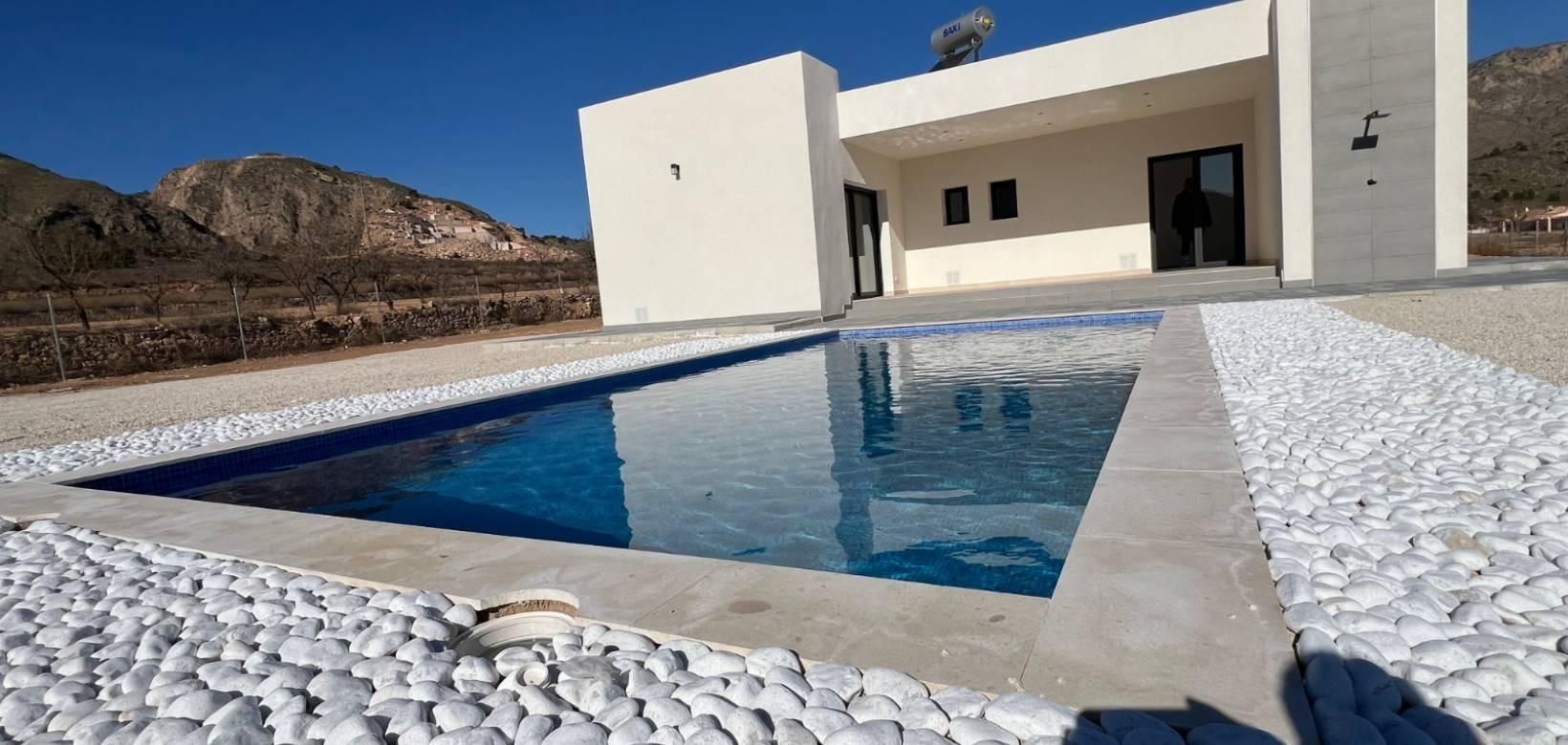 Side elevation of new-build villa on 10,000m2 plot in Hondón de las Nieves
