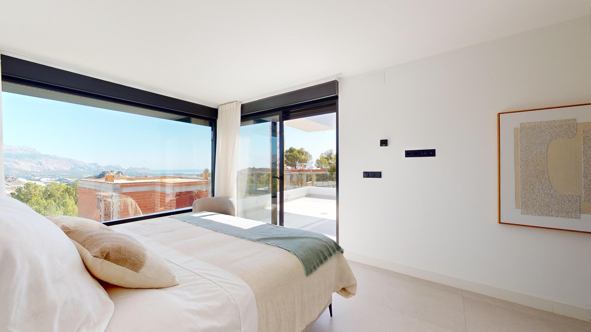 Rear exterior of new-build villa with 434m² plot visible, Pla de Cantal, Polop