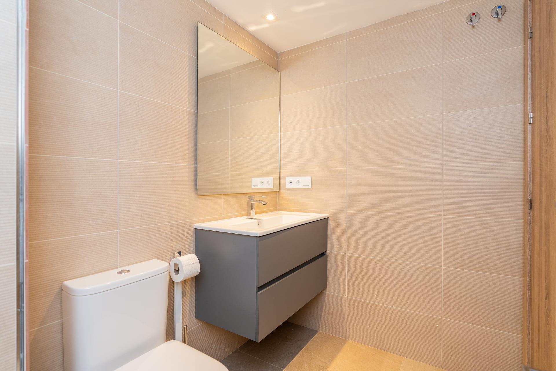 Window detail and natural light in bedroom of new-build apartment, Estepona Golf