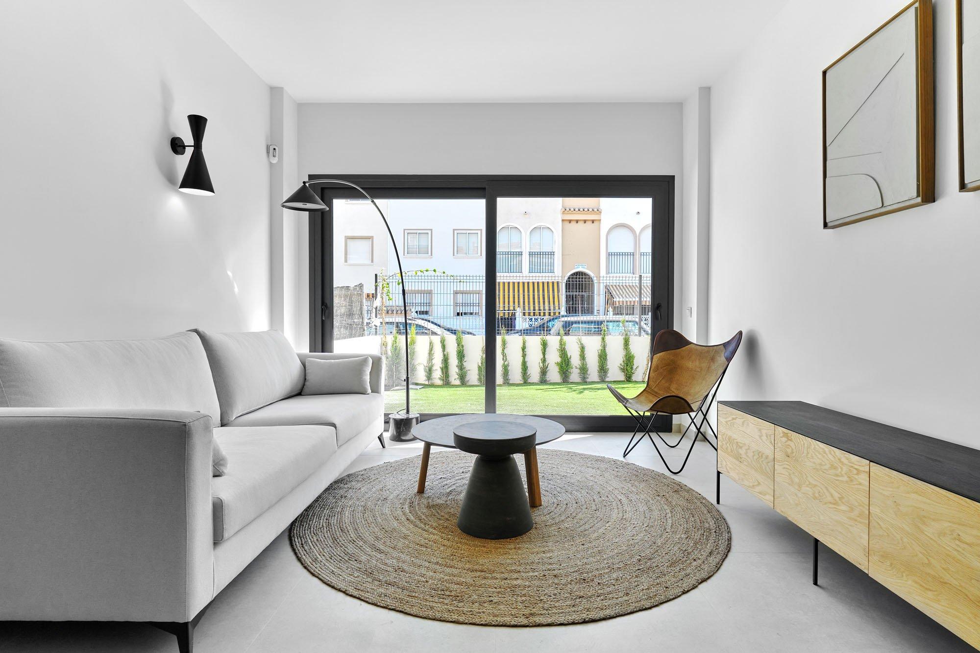 Ceramic-tiled flooring in living area, new-build bungalow, Acequion