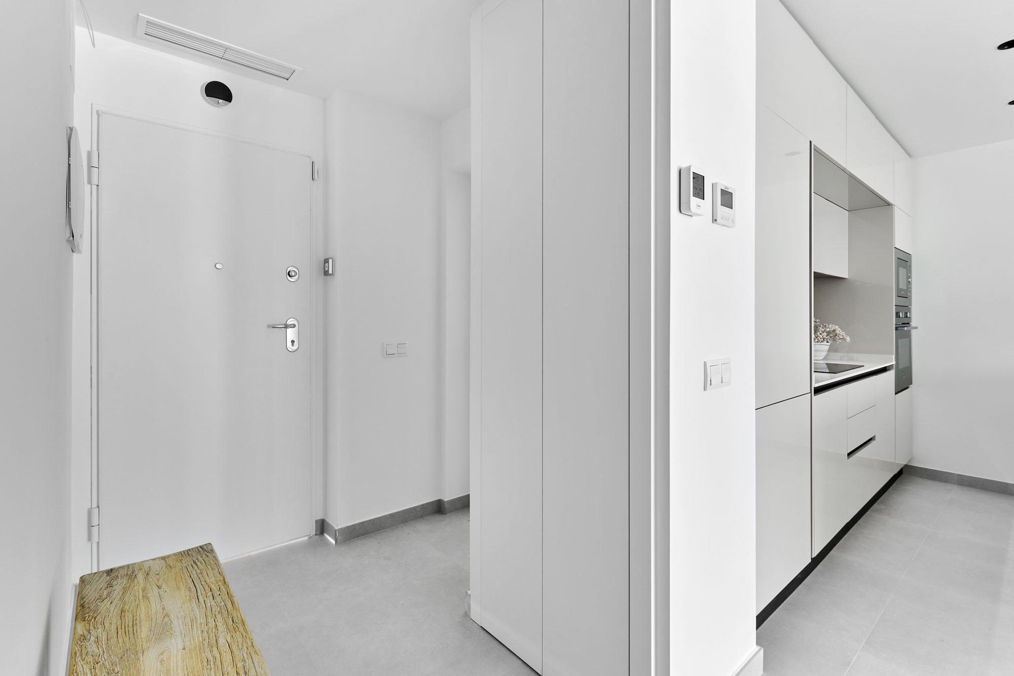 Corridor or communal hallway in new-build complex, Acequion