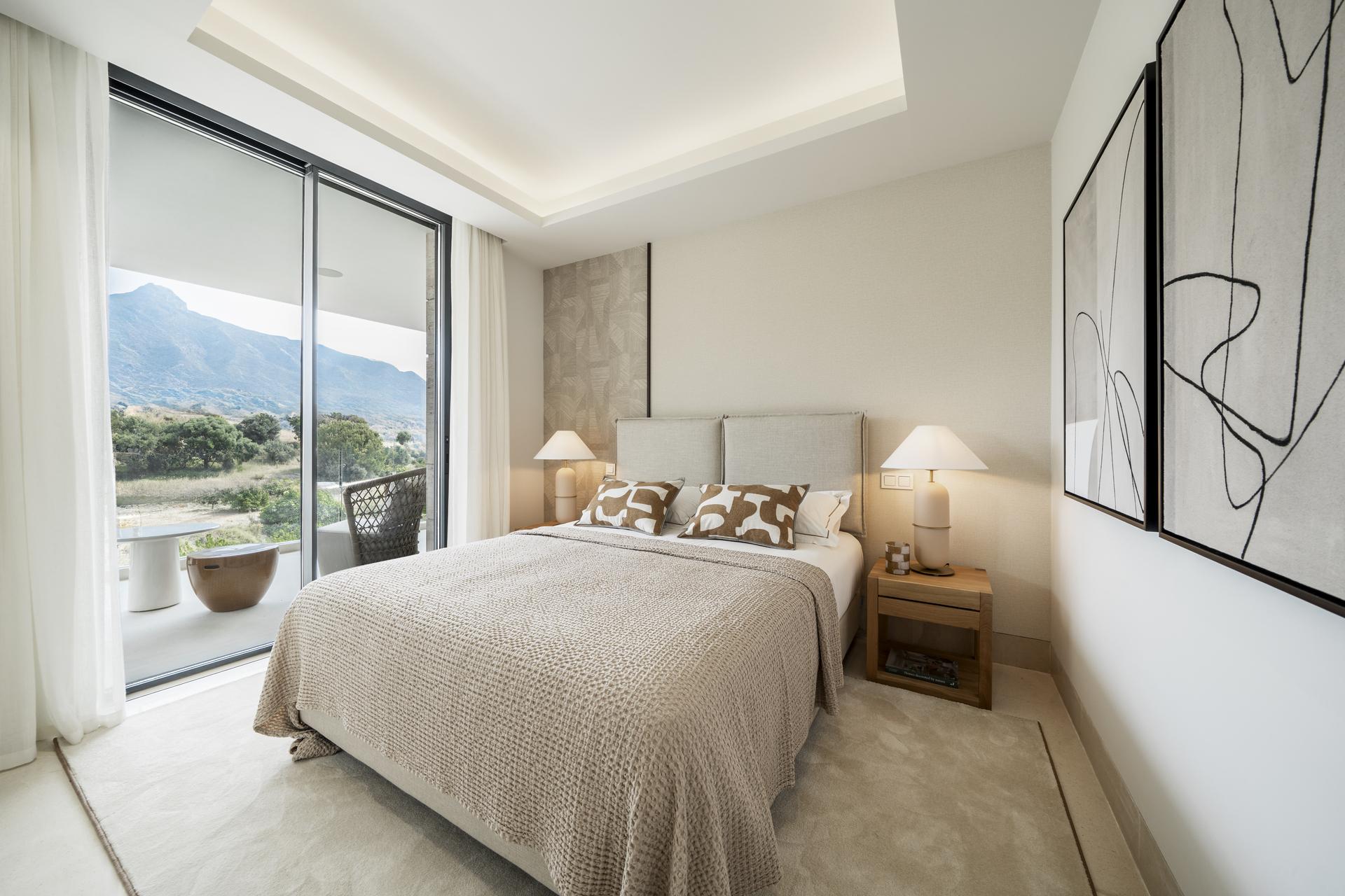Living area with glazed doors opening to private garden, ground-floor apartment, Aloha, Marbella