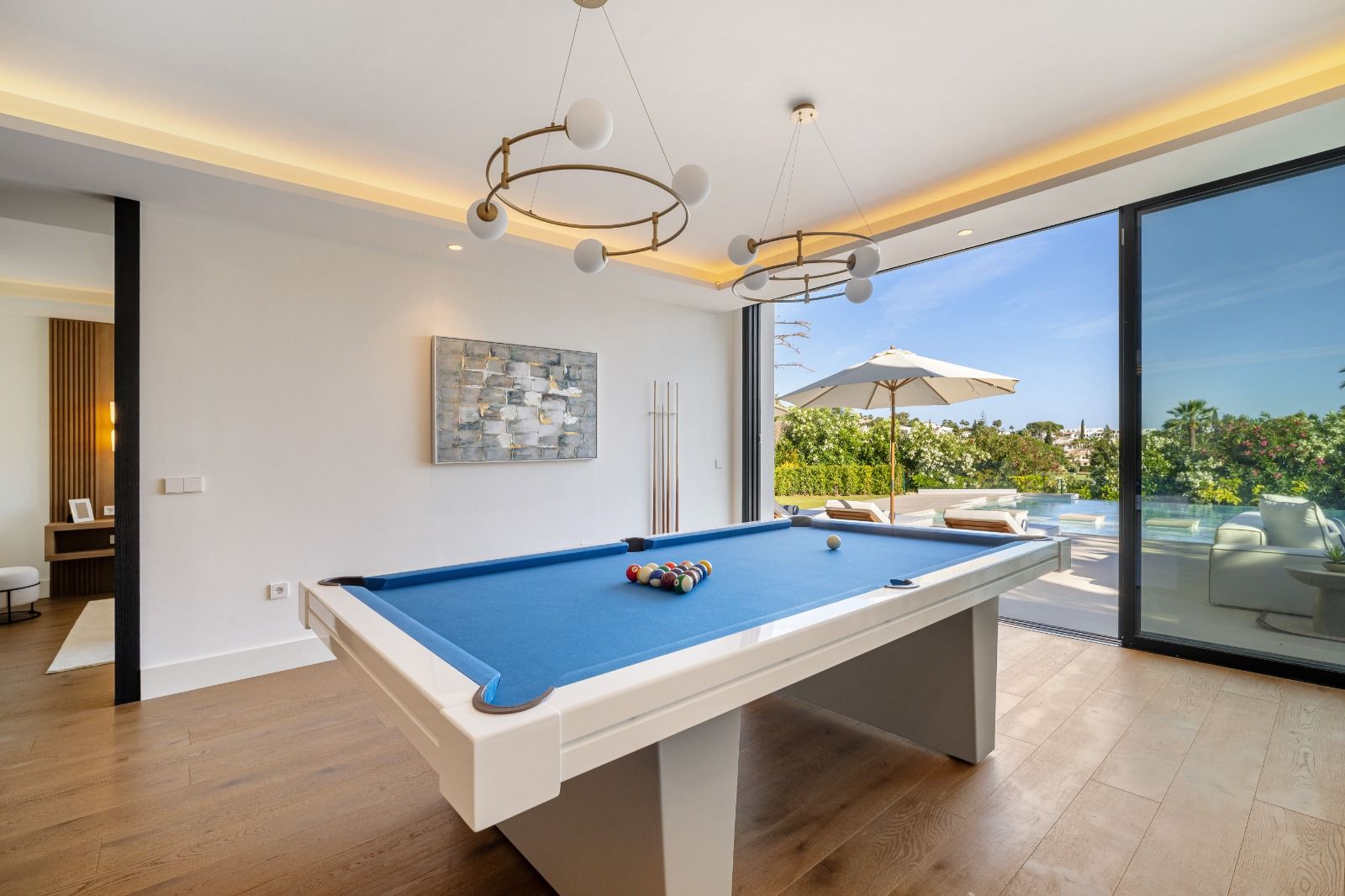 Dining area with glazed doors opening to terrace in 6-bedroom villa, Las Brisas, Marbella