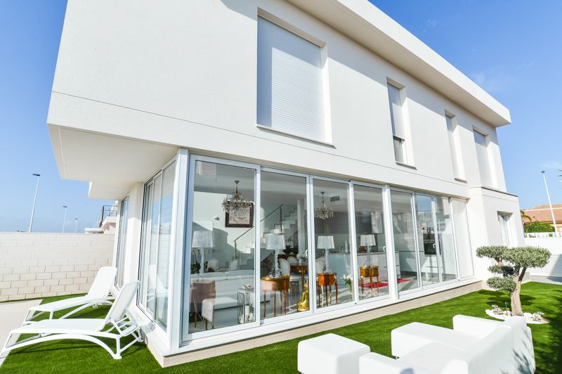 Covered terrace and outdoor dining area of 4-bedroom villa in Monte y Mar