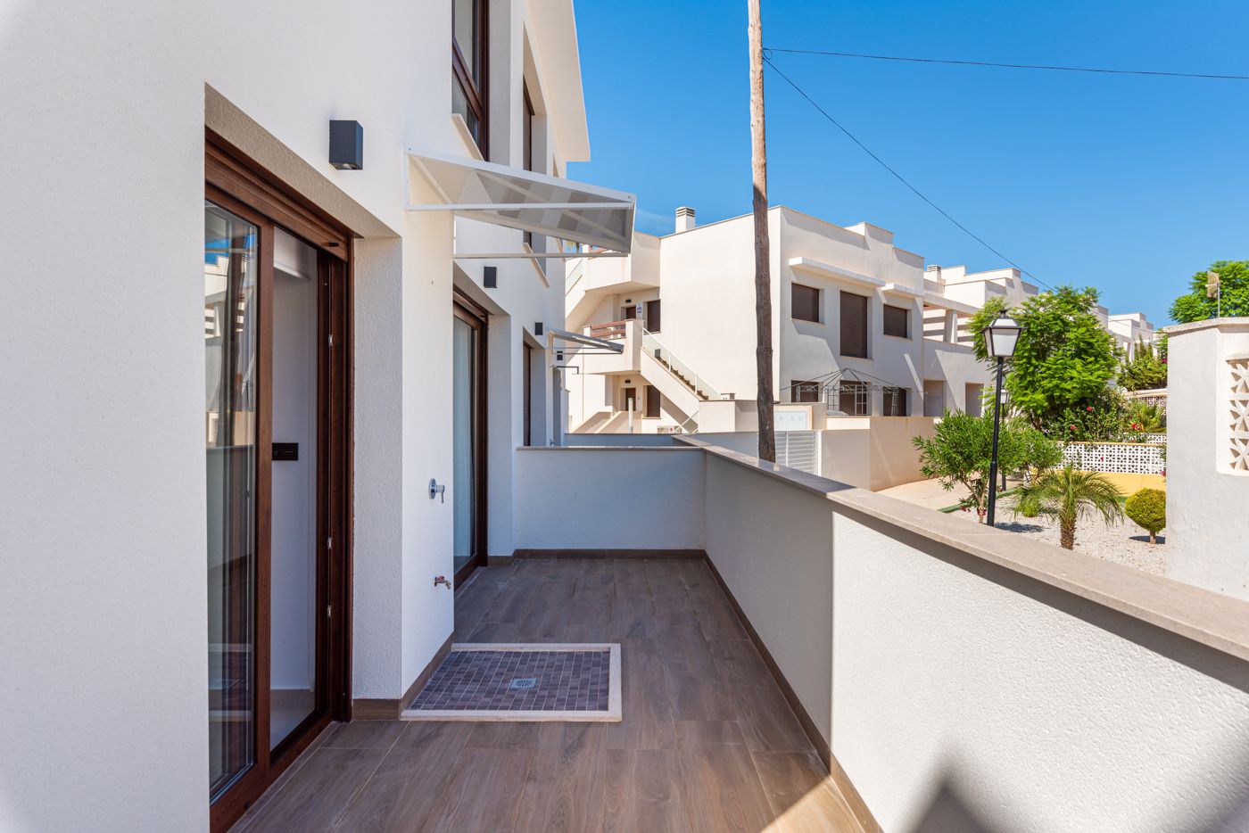 Pool area with surrounding landscaping, Los Balcones, Torrevieja