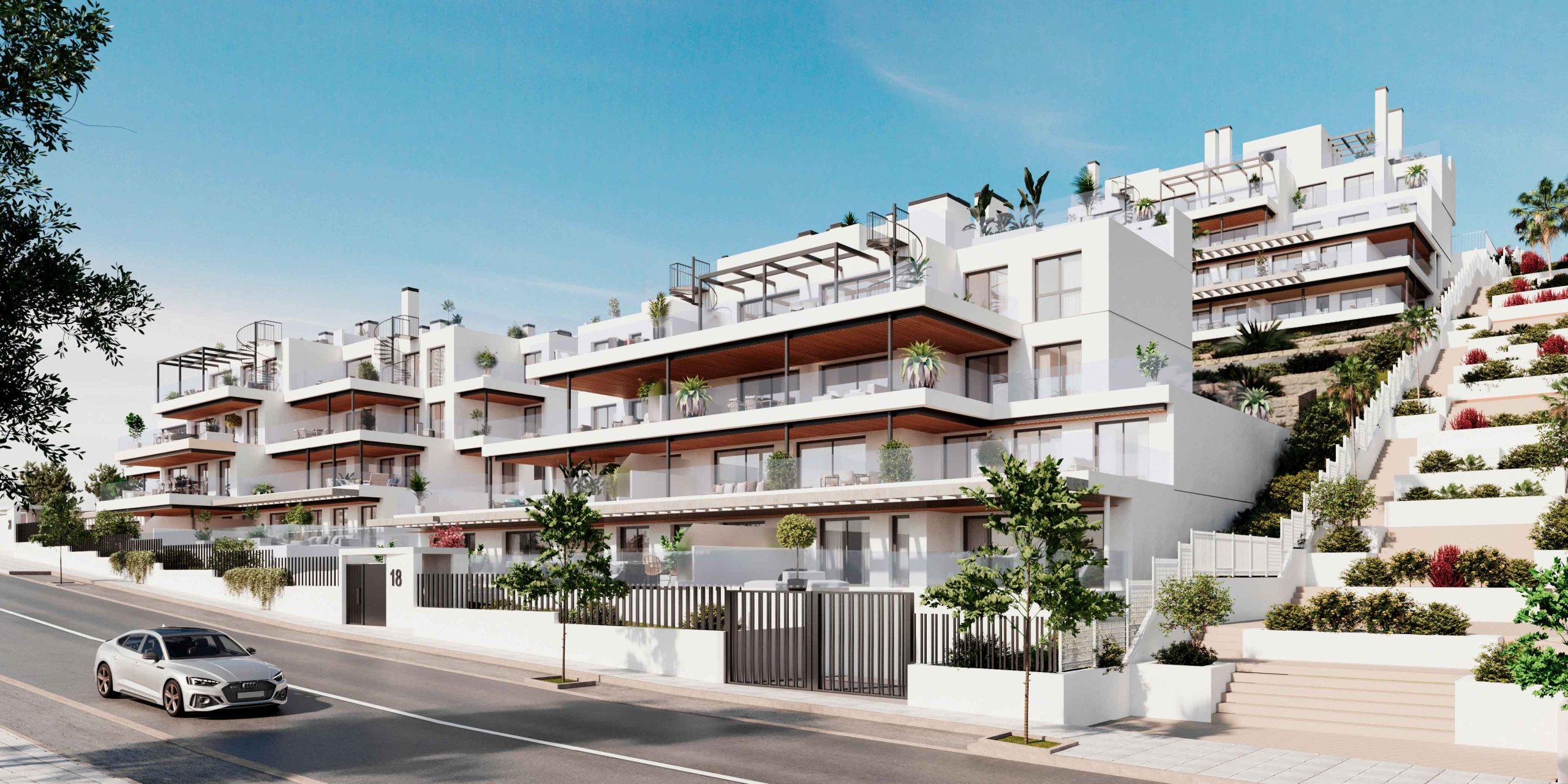 Gated entrance and rendered exterior facade of three-storey new-build complex, Las Mesas, Estepona