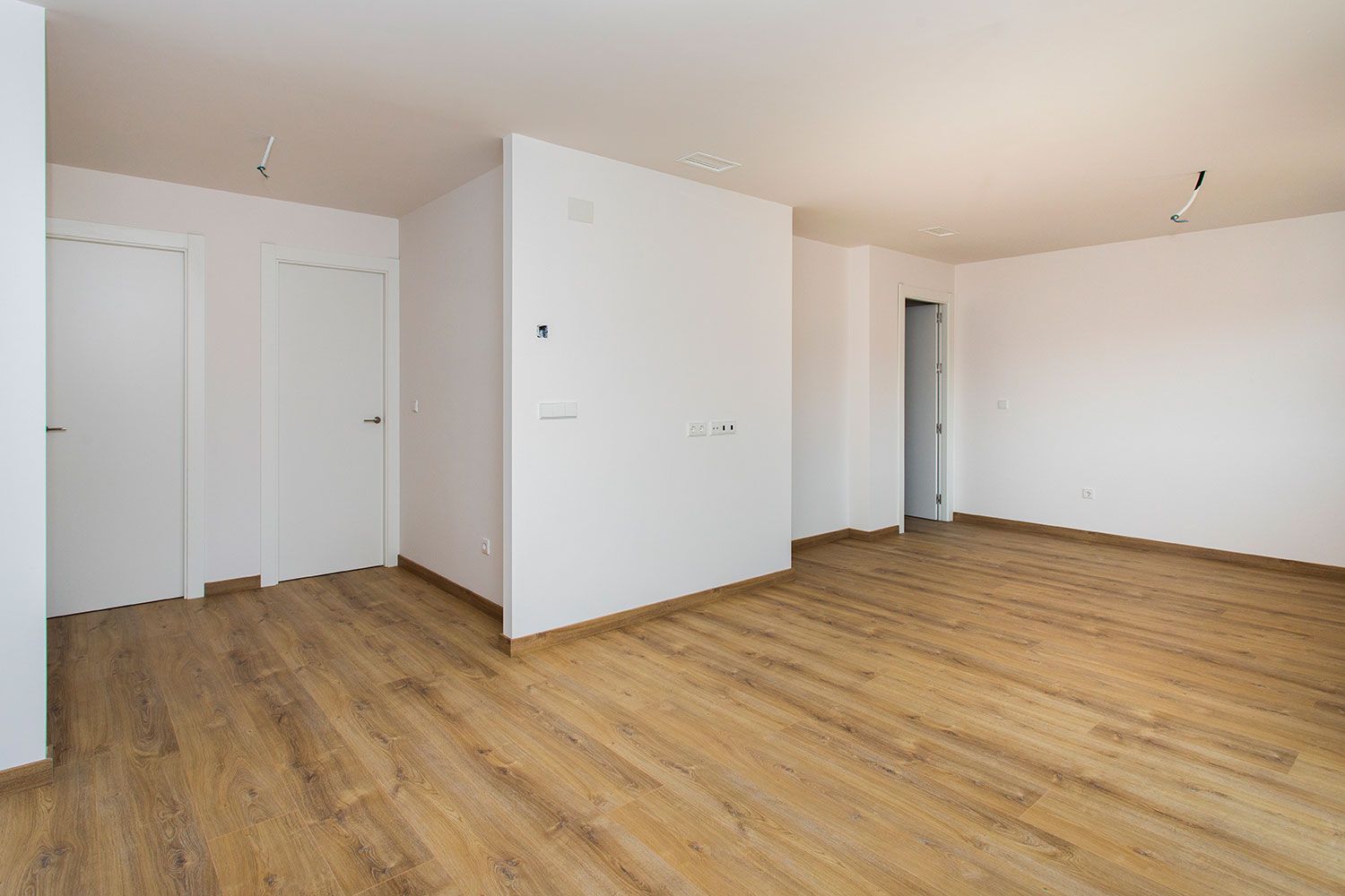 Show unit lounge with included furnishings, La Canalosa development