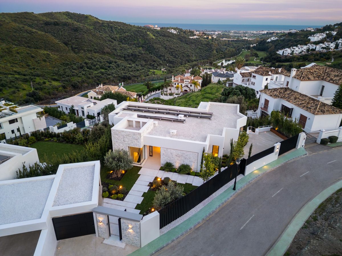 Pool terrace with outdoor seating in new-build villa, La Quinta, Benahavis