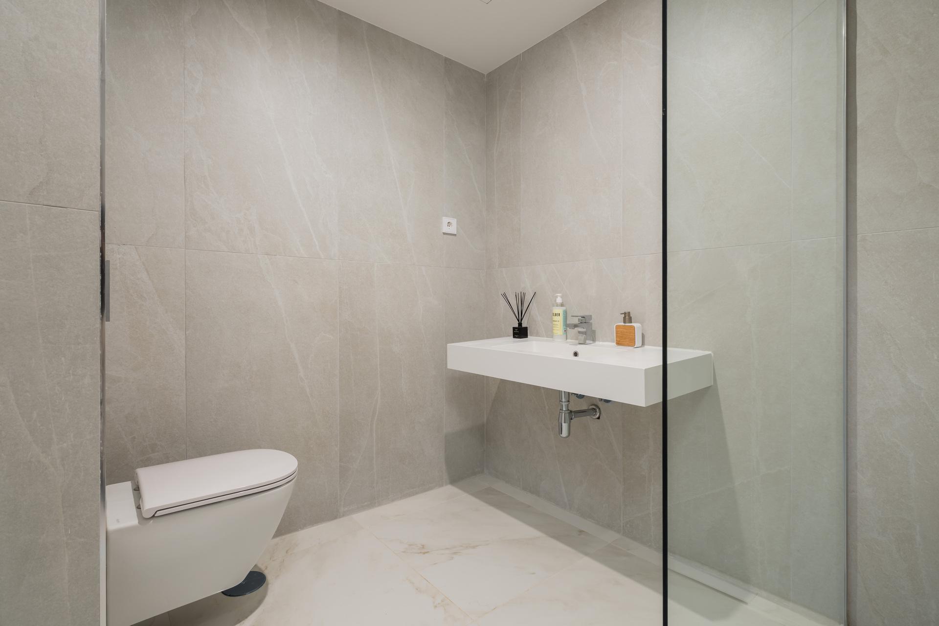 Bathroom with basin and mirror, new-build penthouse, Arroyo Vaquero