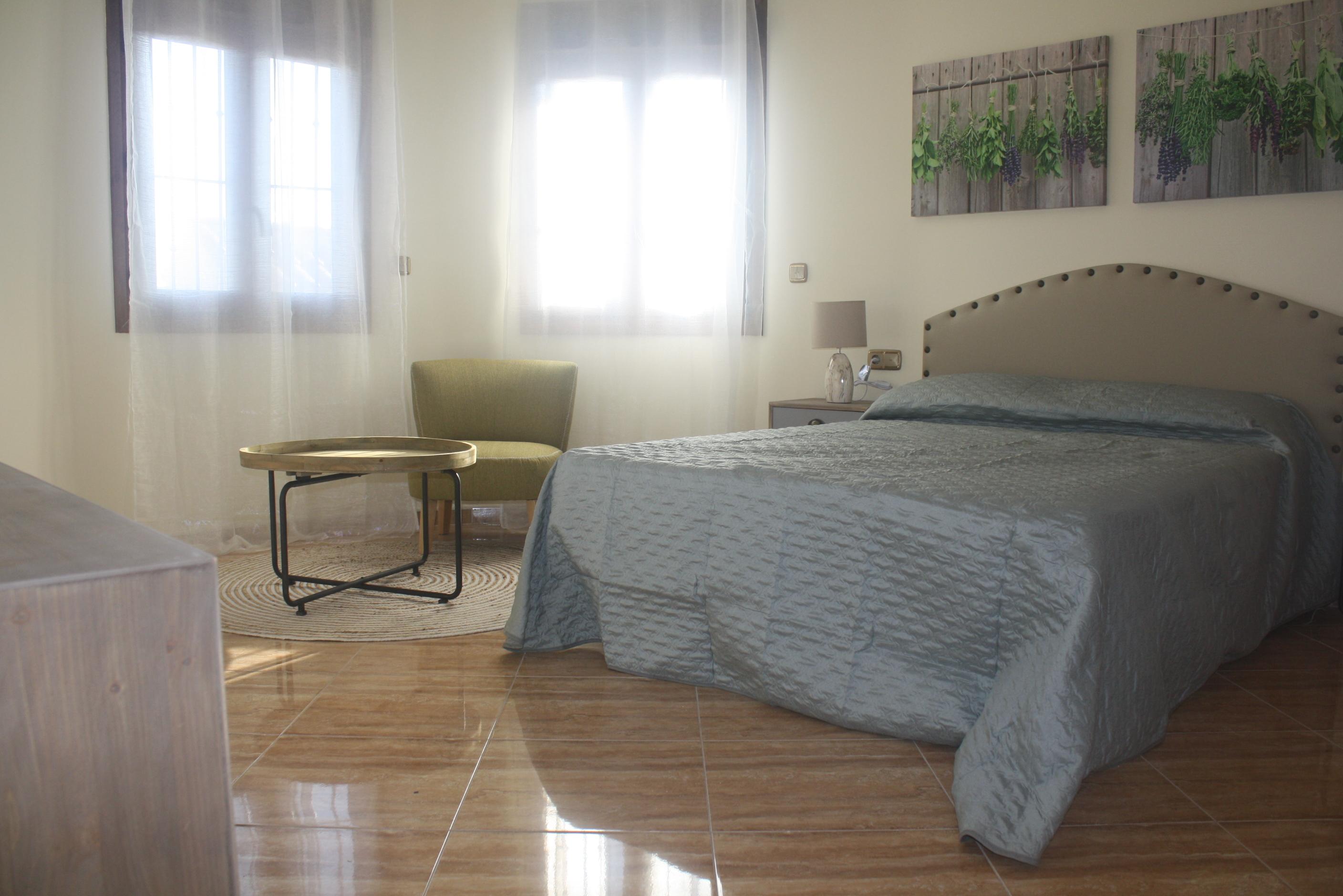 Side elevation of 3-bedroom new-build villa in Los Balcones showing plot boundary and driveway