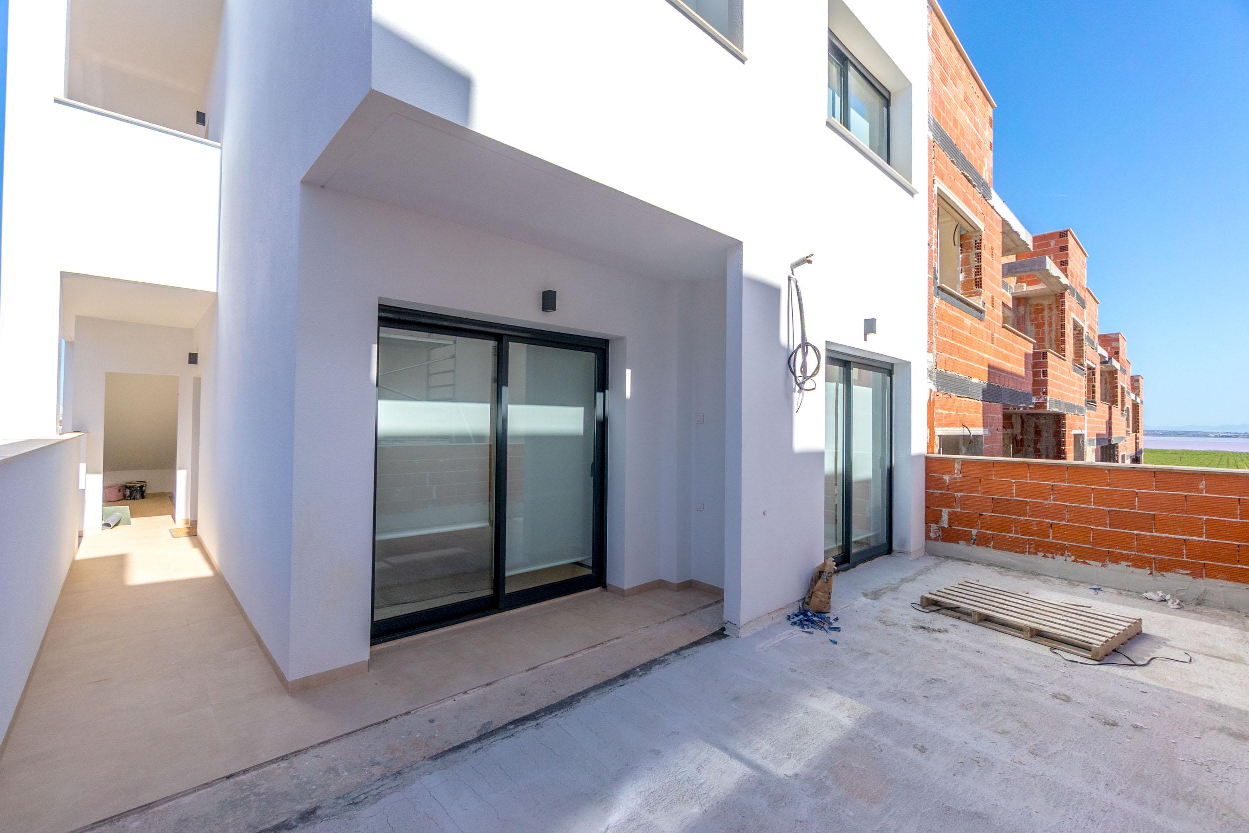Communal pool with paved surround and seating, Lago Jardín, Torrevieja