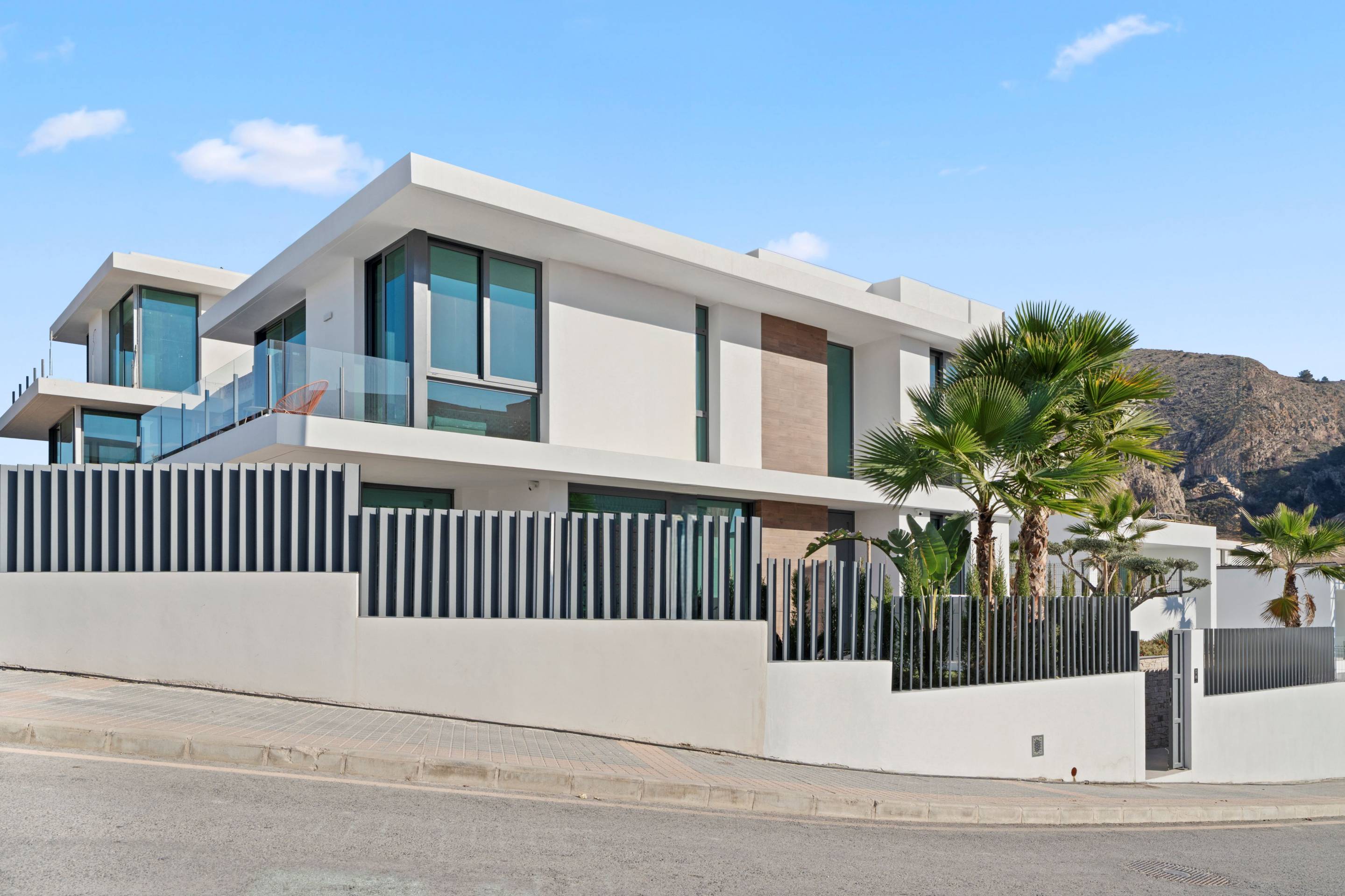 Exterior facade of new-build villa with outdoor lighting at dusk, Rincón de Loix, Benidorm