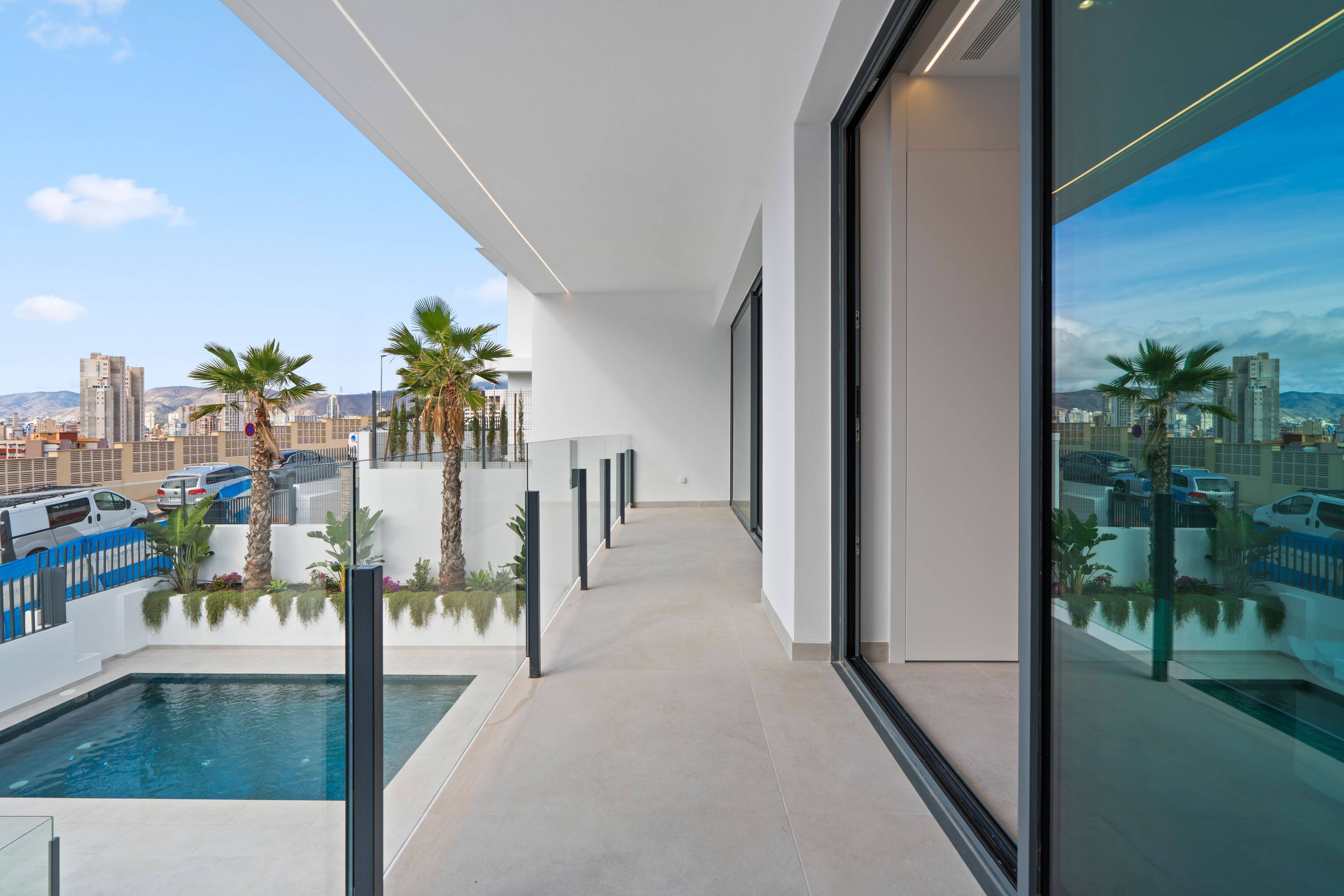 Rear exterior of new-build villa showing garden and pool surround, Rincón de Loix, Benidorm