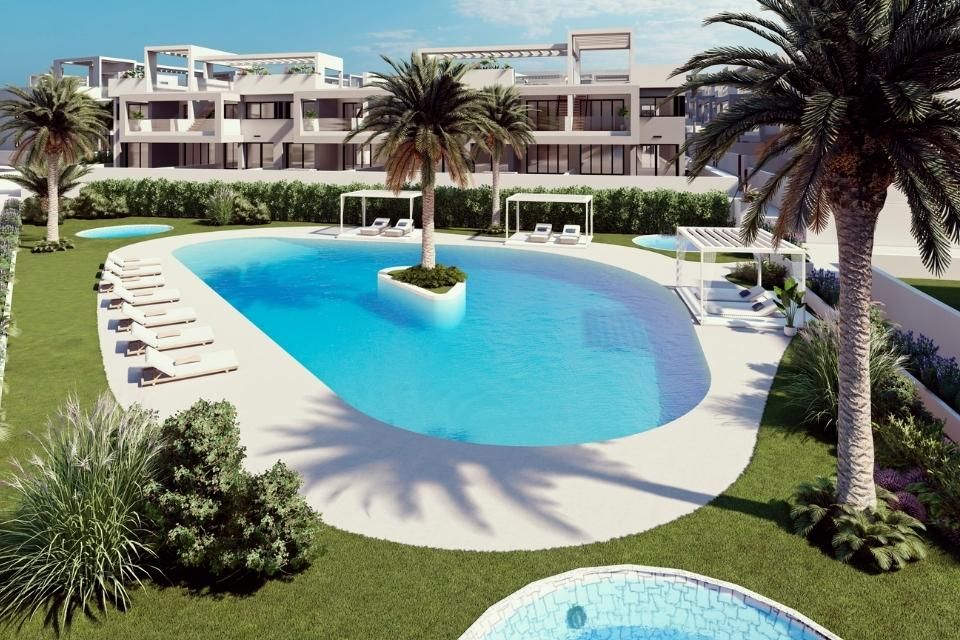 Communal swimming pool with sun terrace at new-build development, Los Balcones, Torrevieja