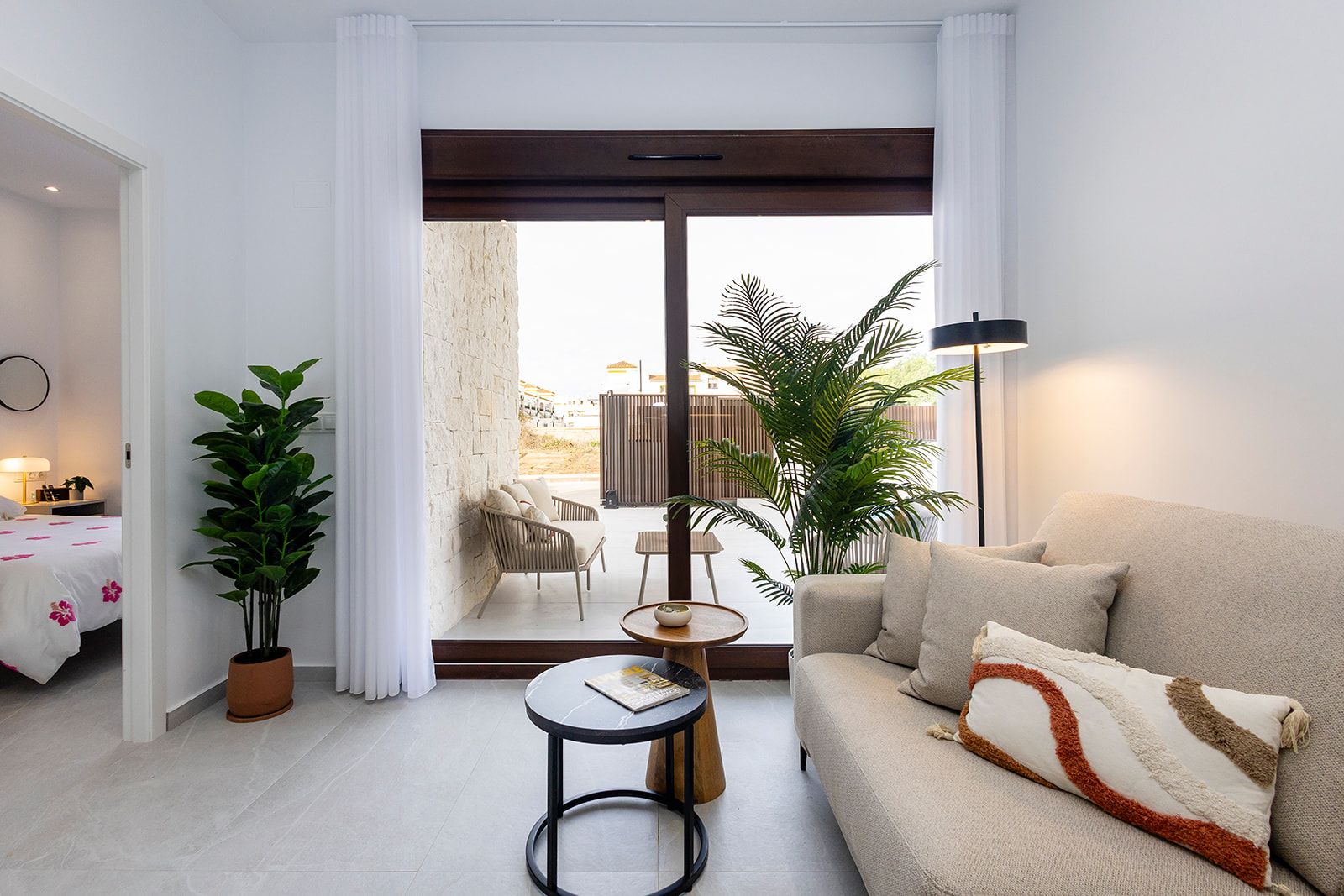 Private garden with planted beds and rendered boundary wall in new-build townhouse, Desamparados, Orihuela
