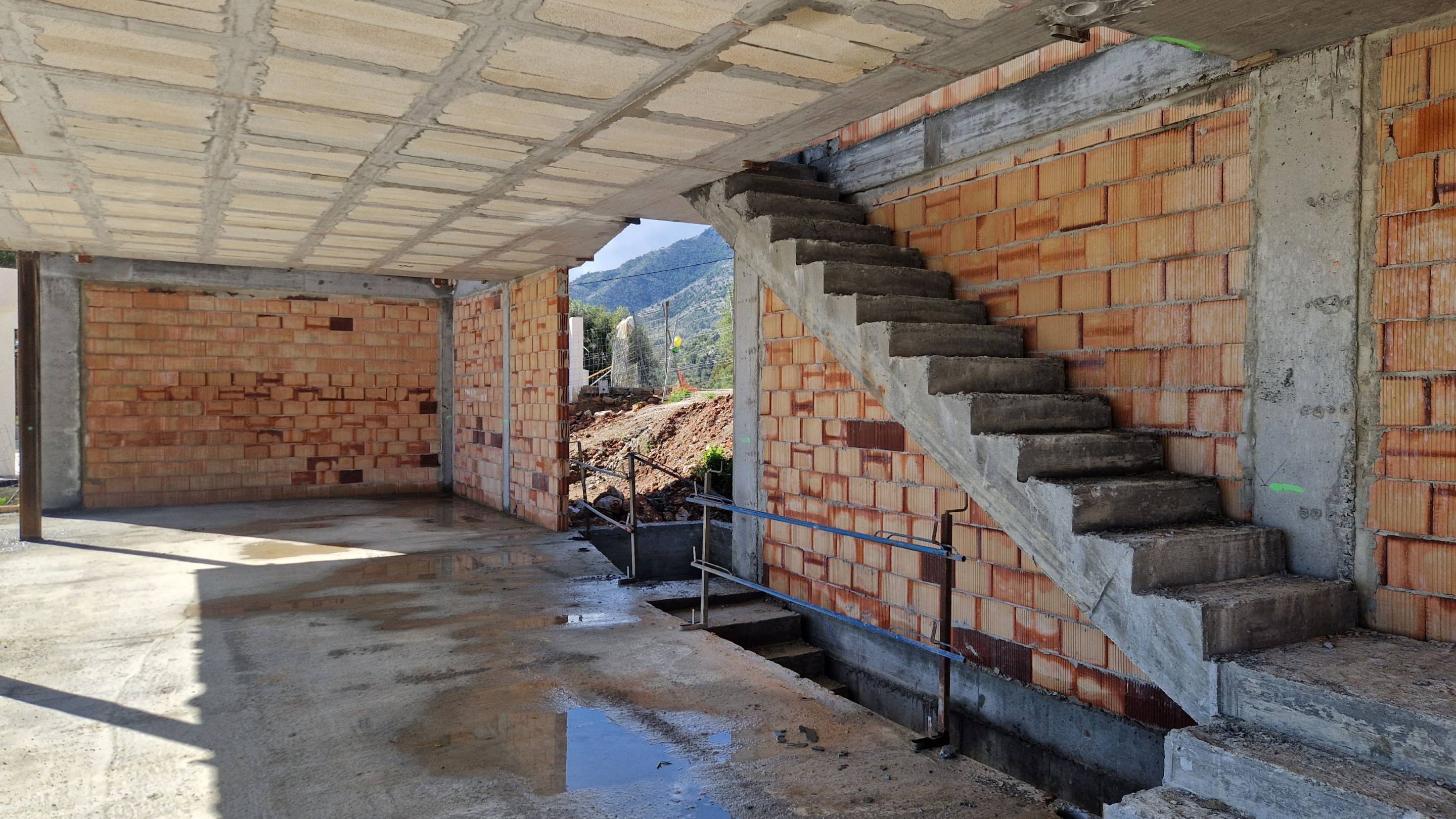 Internal hallway in 5-bedroom new-build villa, Mijas Pueblo, with tiled floor and staircase