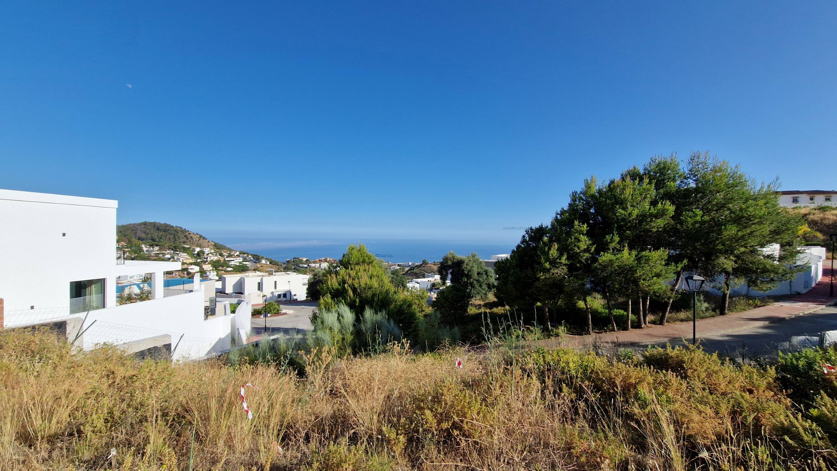 Open-plan living area in 5-bedroom new-build villa, Mijas Pueblo, with tiled flooring and large windows
