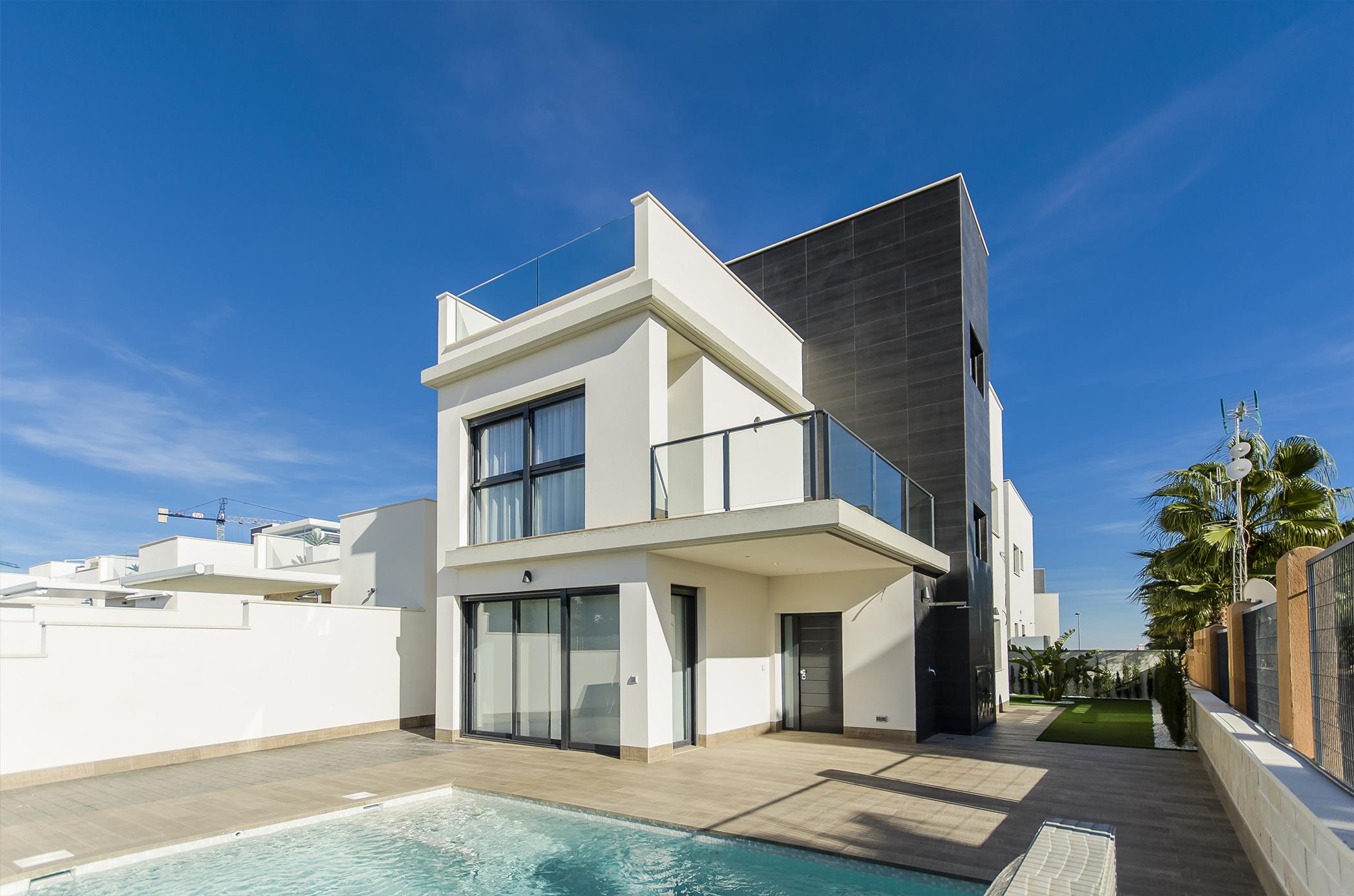 Front facade and entrance of new-build villa in Bellavista, San Miguel De Salinas, with two parking spaces