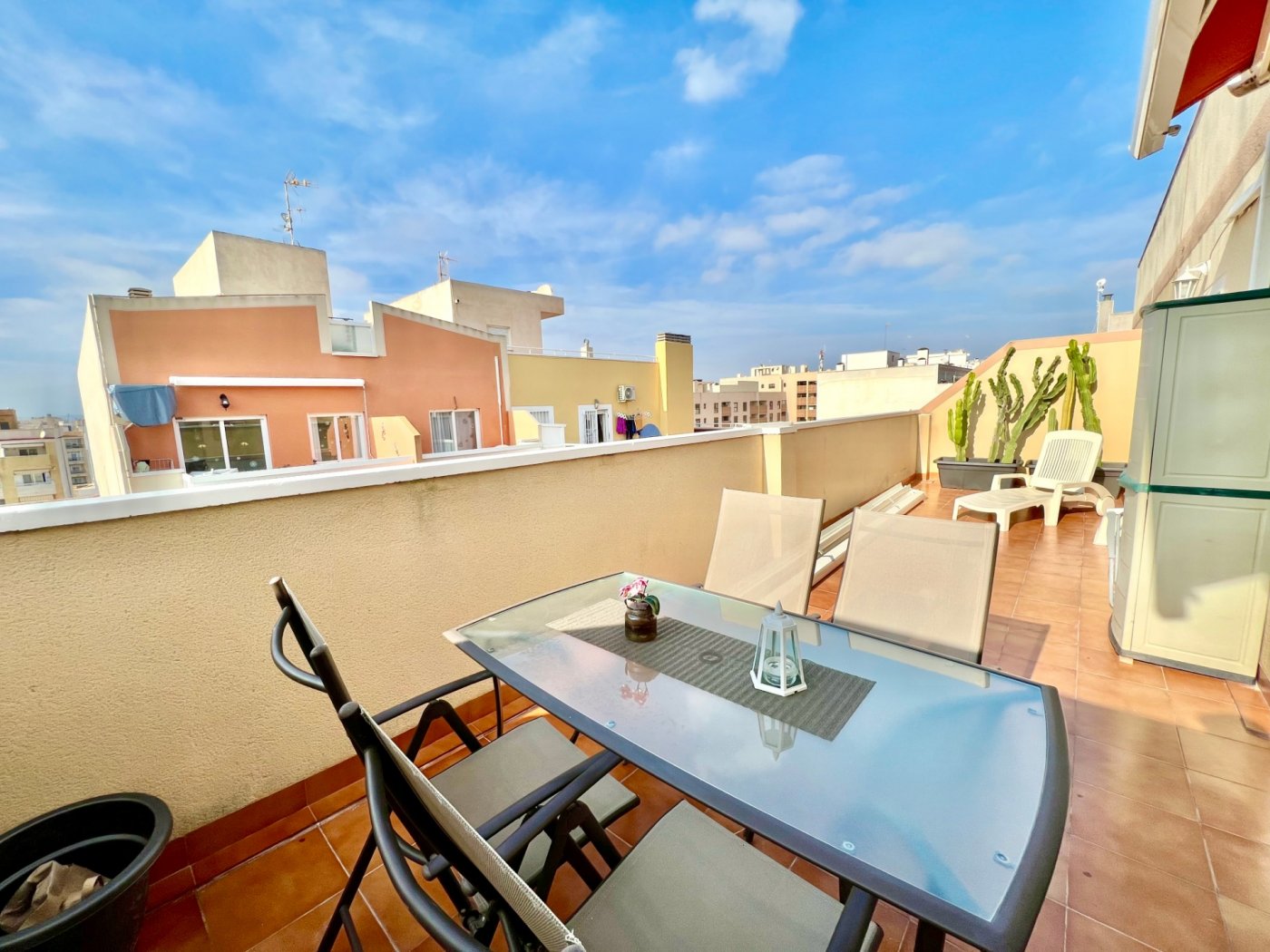 Living area with natural light through large windows, penthouse in Centro, Torrevieja