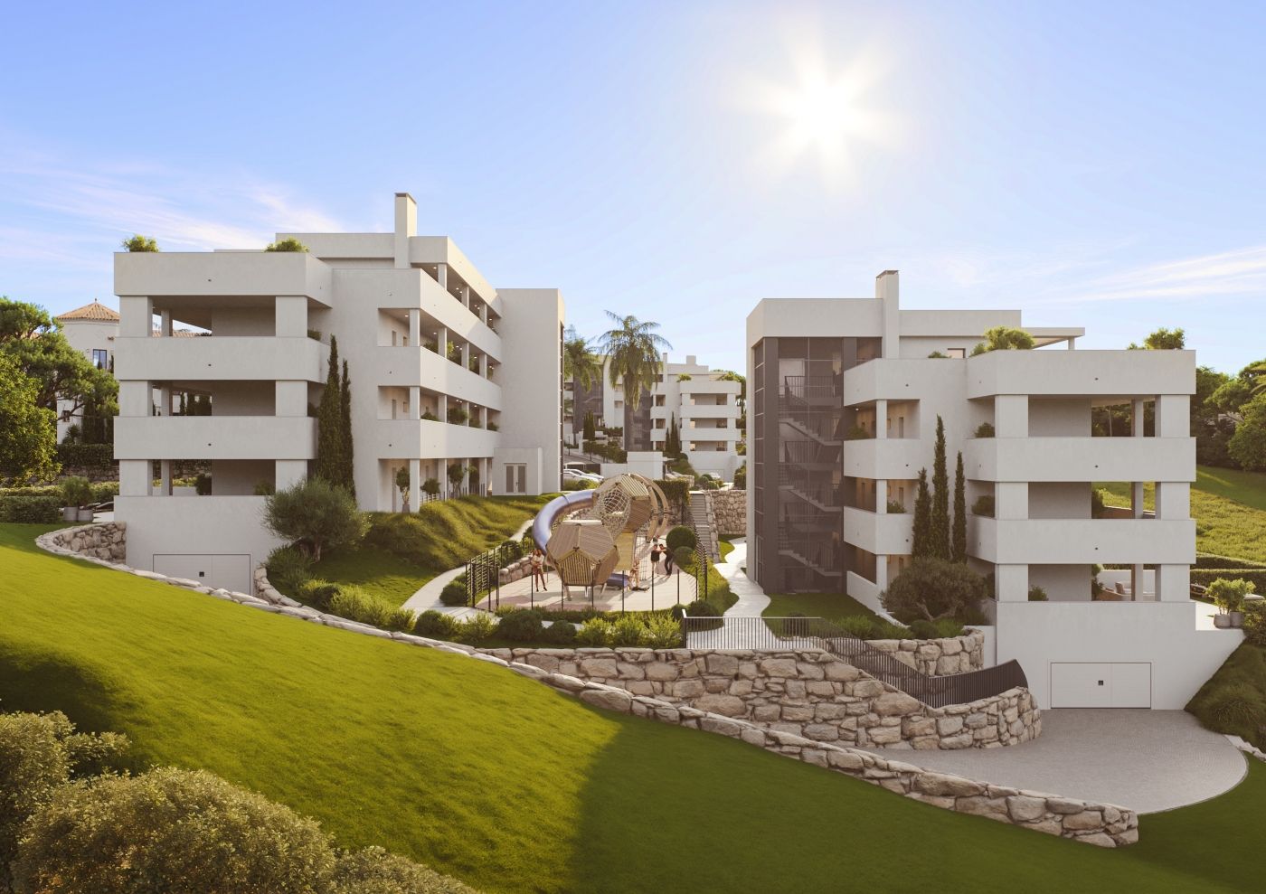 Communal green area with seating, El Castillo development, Manilva