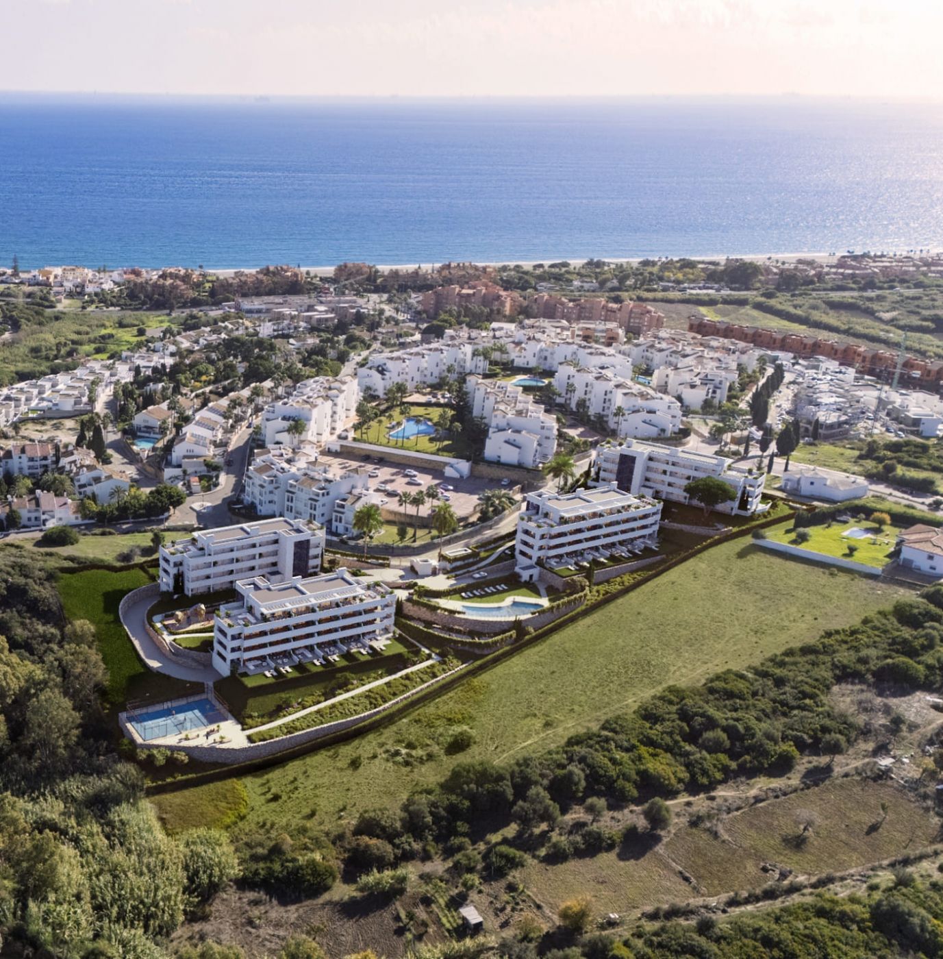 Landscaped communal area with mature planting, El Castillo development
