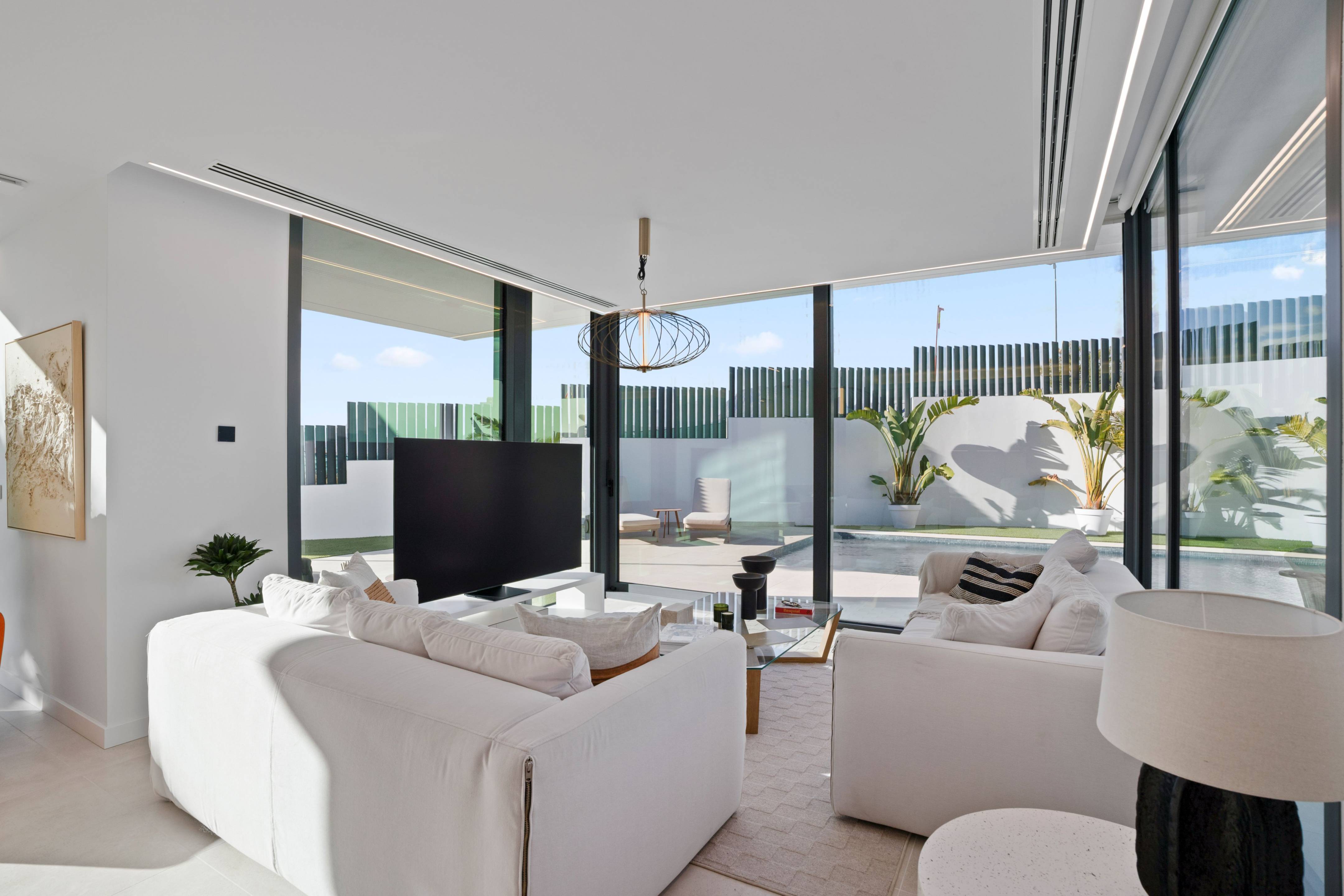 Exterior of new-build villa at night with pool lighting, Rincón de Loix, Benidorm