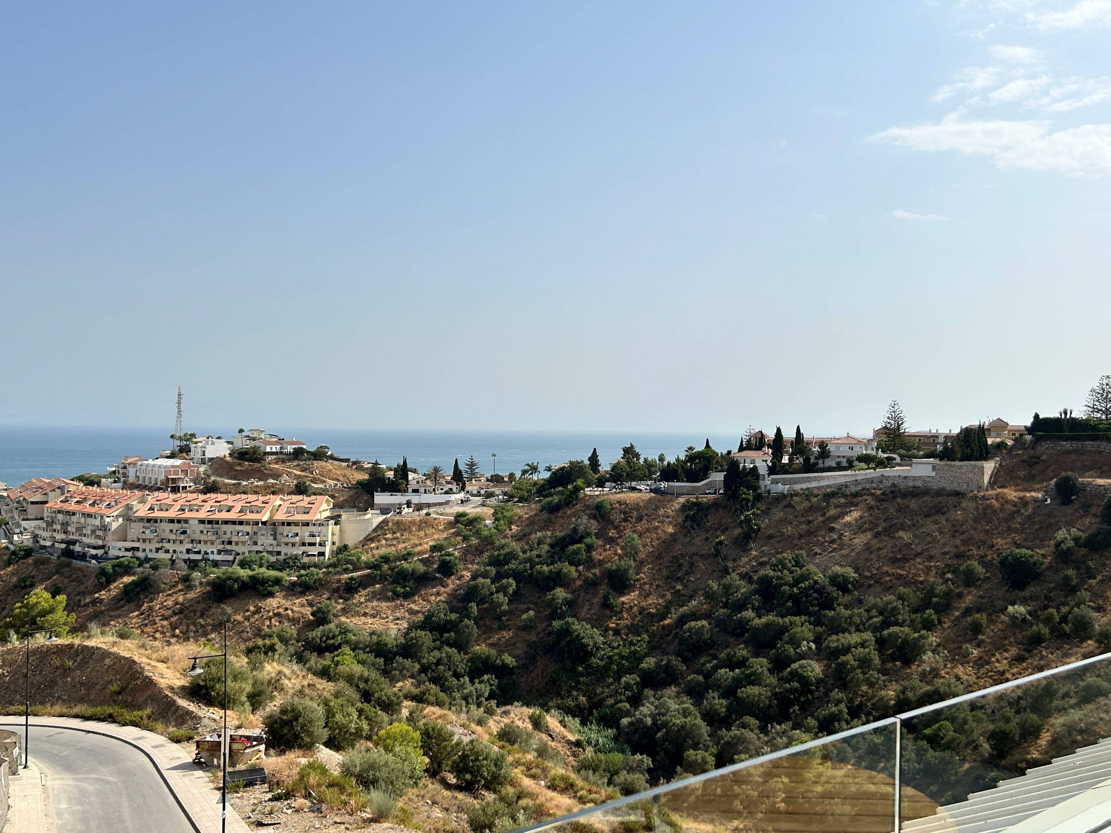 Communal pool and surrounding terrace in El Higuerón development, Fuengirola