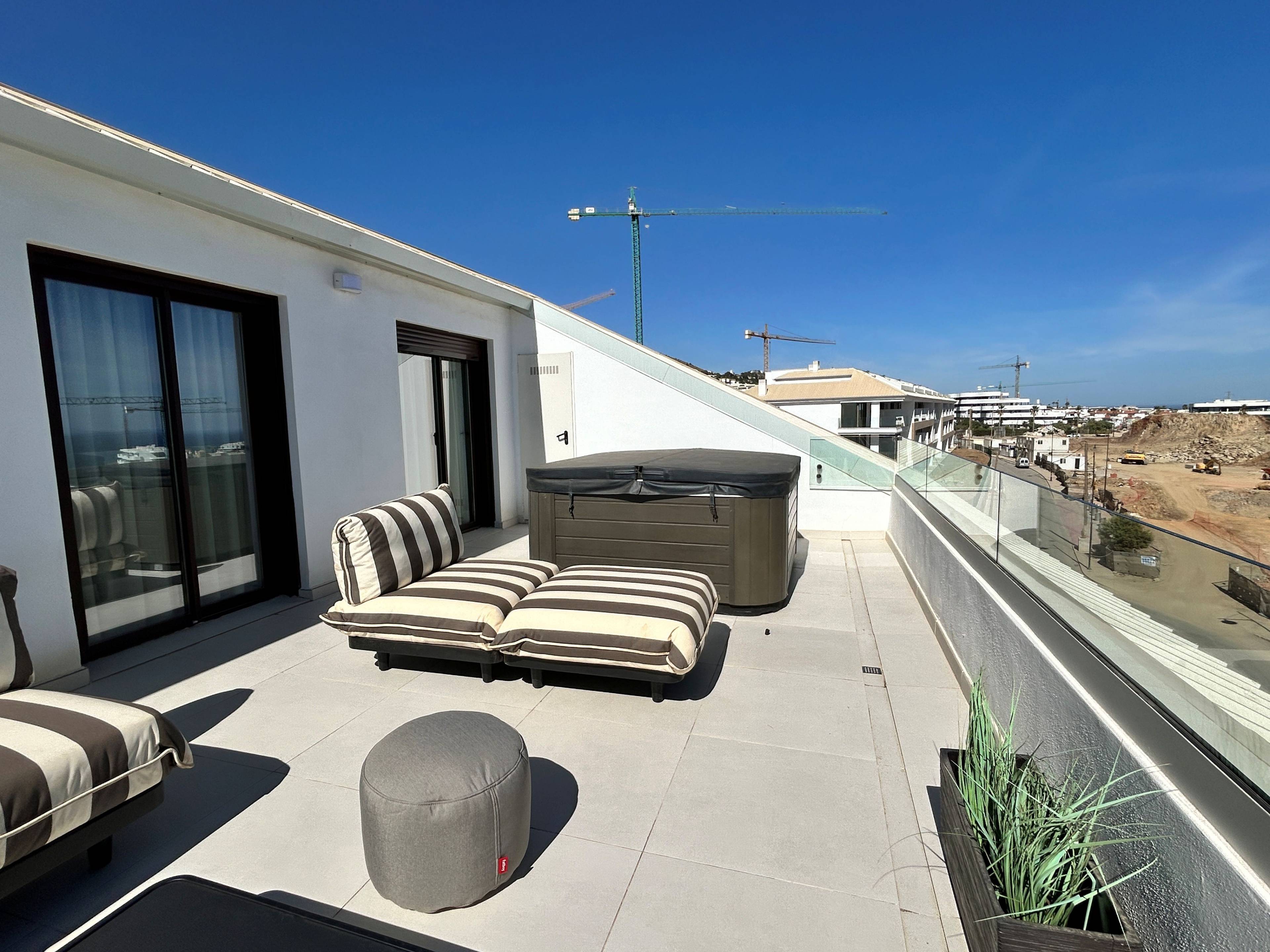 Living and dining area viewed from entrance hallway, 193 m2 penthouse, El Higuerón