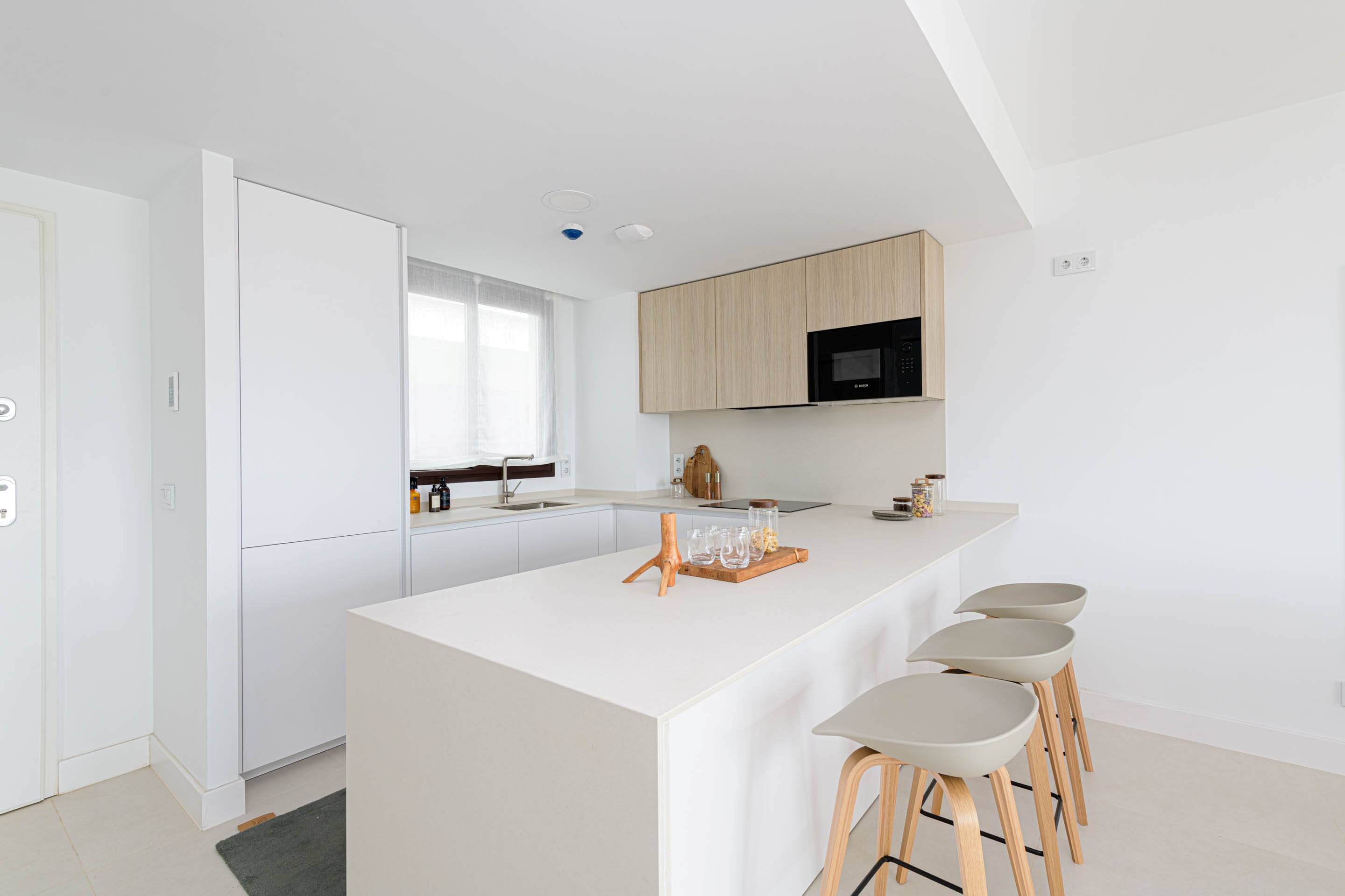 Bedroom with window overlooking development, new-build penthouse, El Higuerón