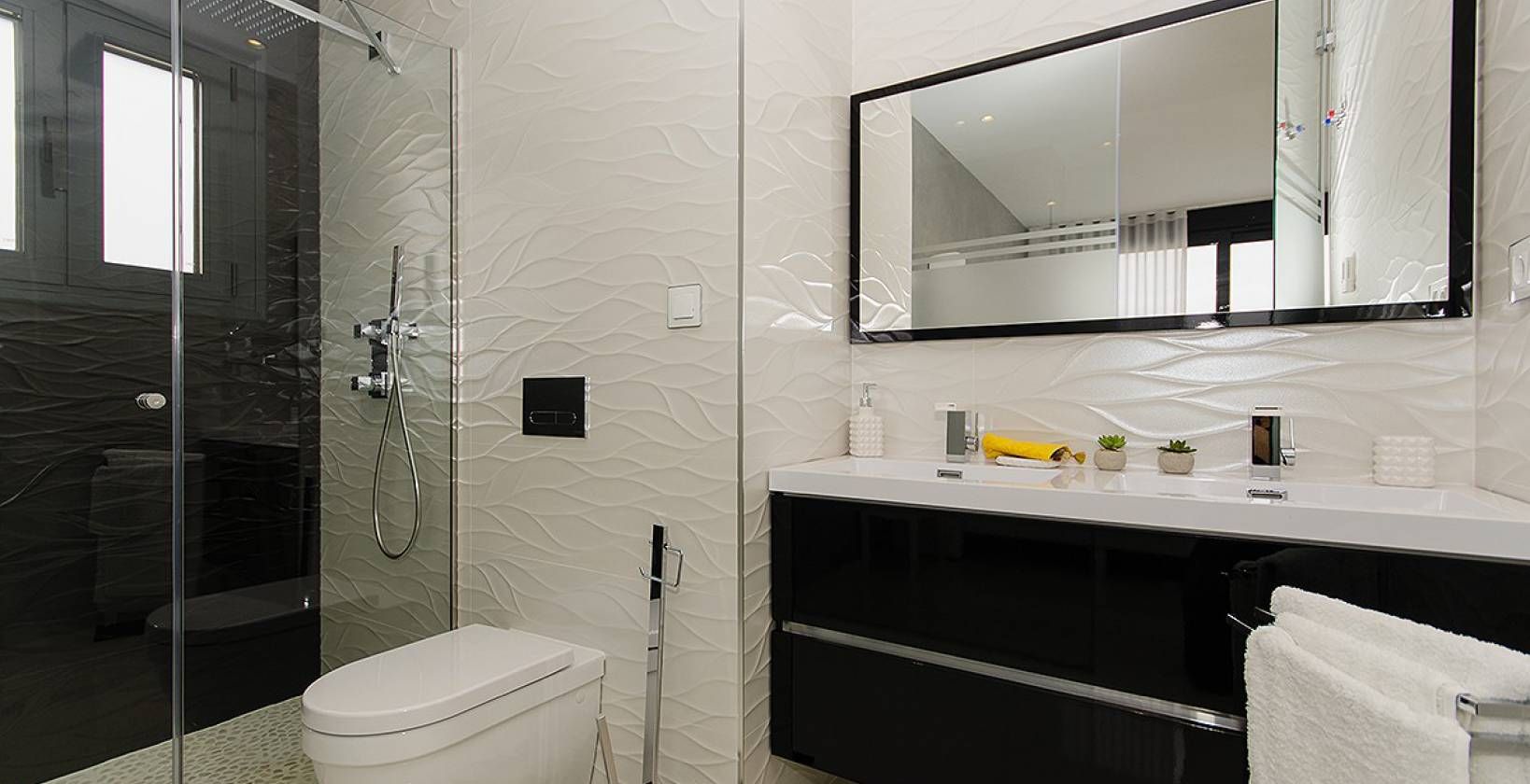 En-suite bathroom with contemporary tiling in new-build villa, Campoamor