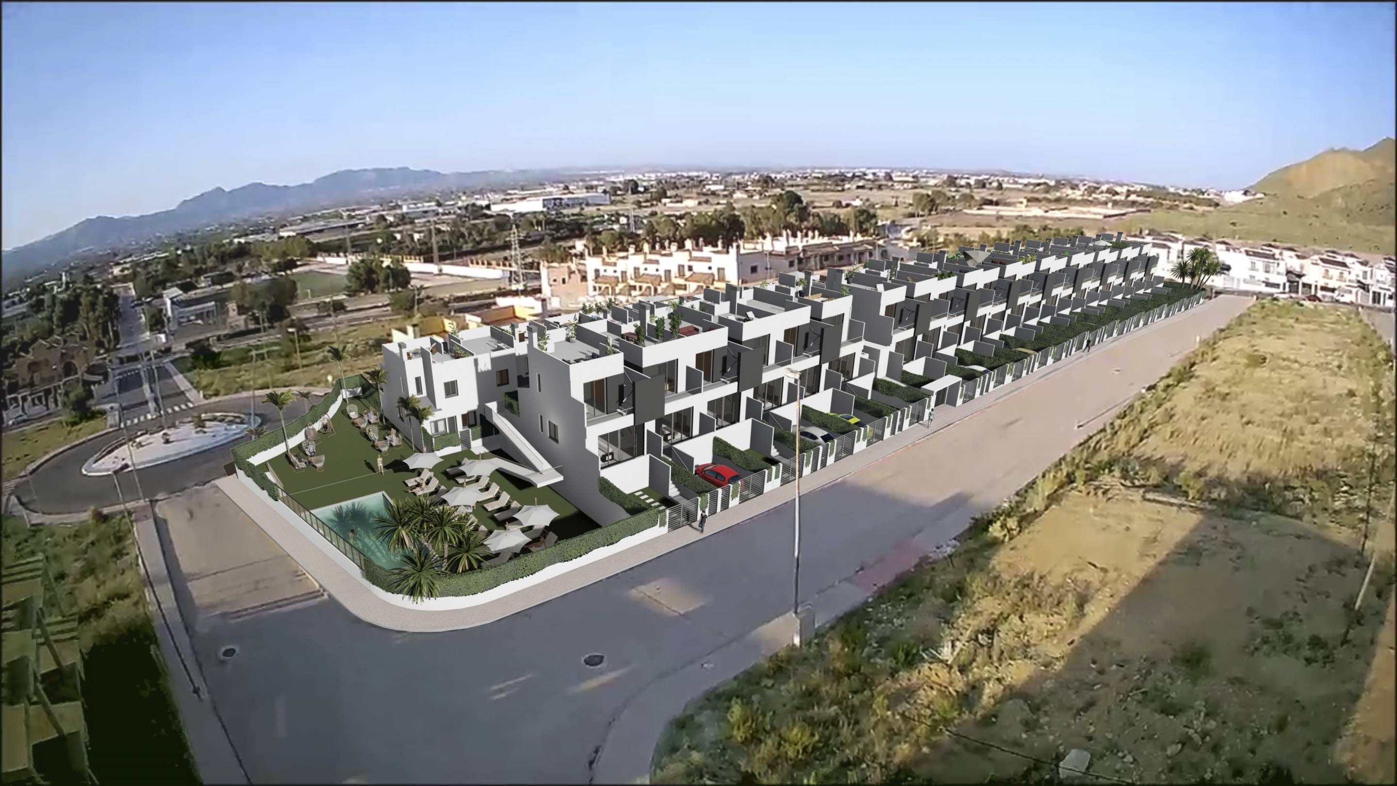 Communal pool surrounded by planted landscaping in development, Cox