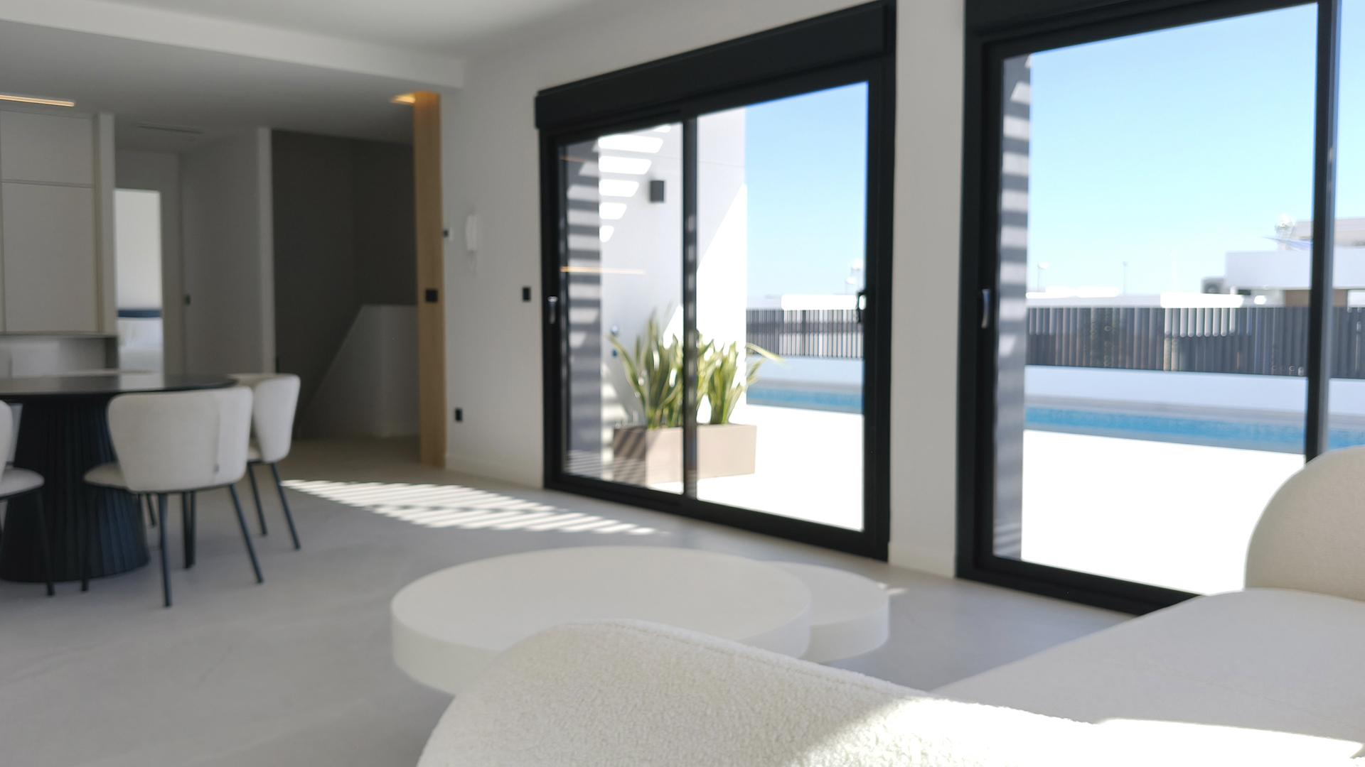 Swimming pool with pergola visible in background, new-build villa, Rojales