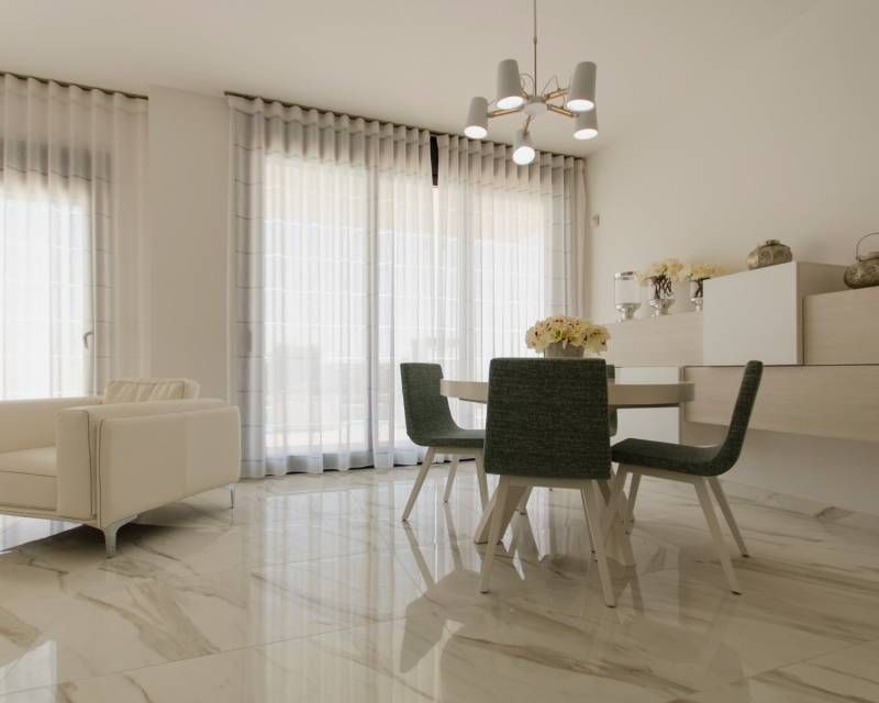Rear facade of 4-bedroom villa in Campoamor with covered terrace and outdoor area