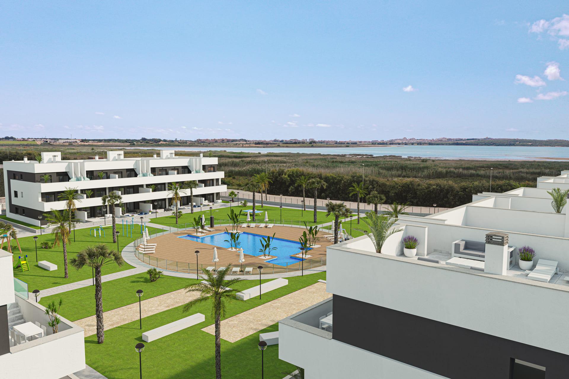 Communal pool area of new-build residential complex, El Raso