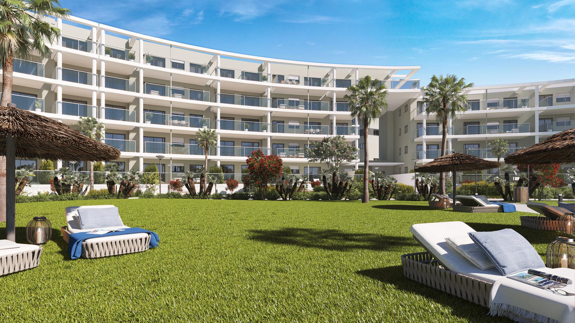 Side elevation of four-storey new-build apartment building exterior, Chullera, Manilva