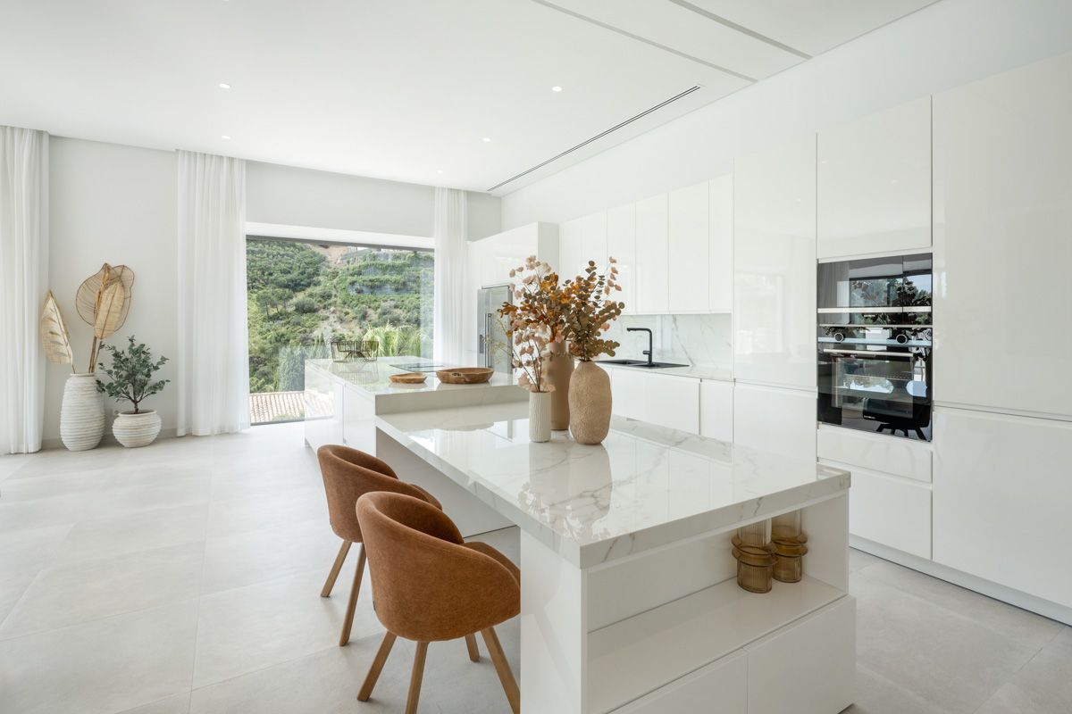 Kitchen with island and integrated appliances in new-build villa, La Zagaleta-El Madroñal