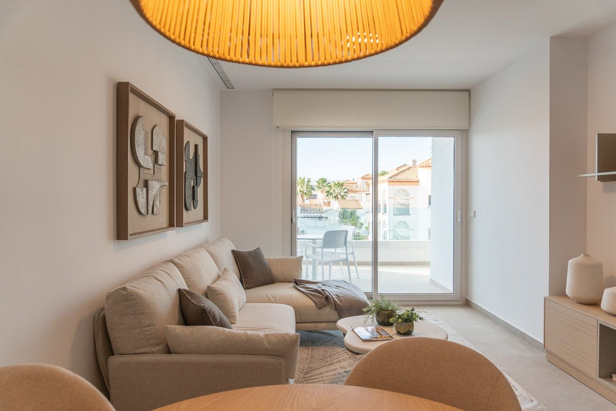 Communal pool area with evening lighting, La Zenia development