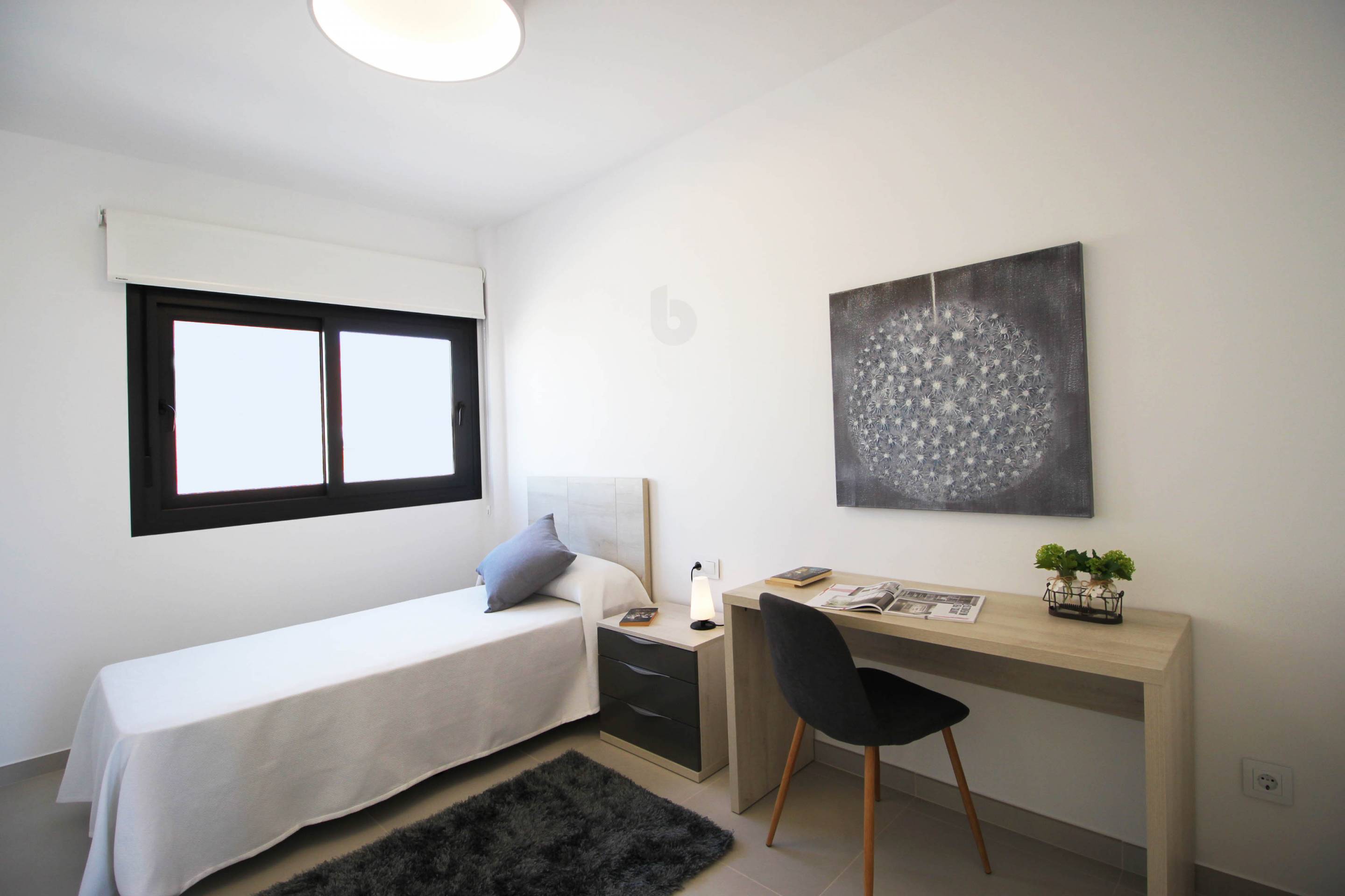 Bedroom interior in new-build apartment beside golf course, Lo Romero Golf