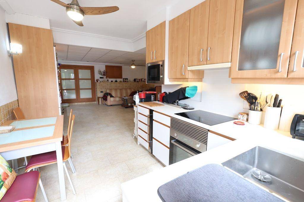 Shared grounds of residential complex in La Caleta, Cabo Roig