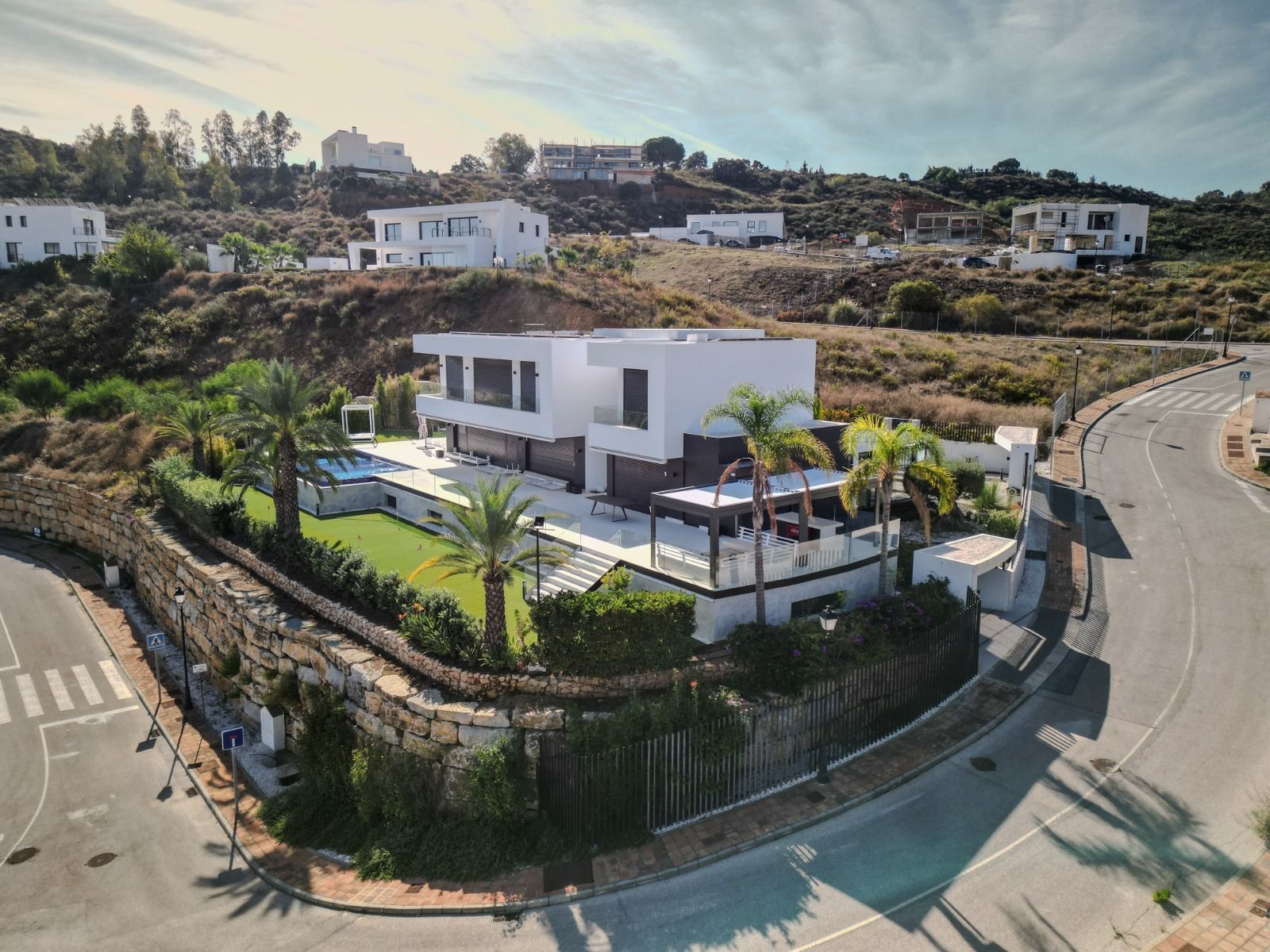 Covered outdoor terrace with seating area at rear of villa, La Cala Golf
