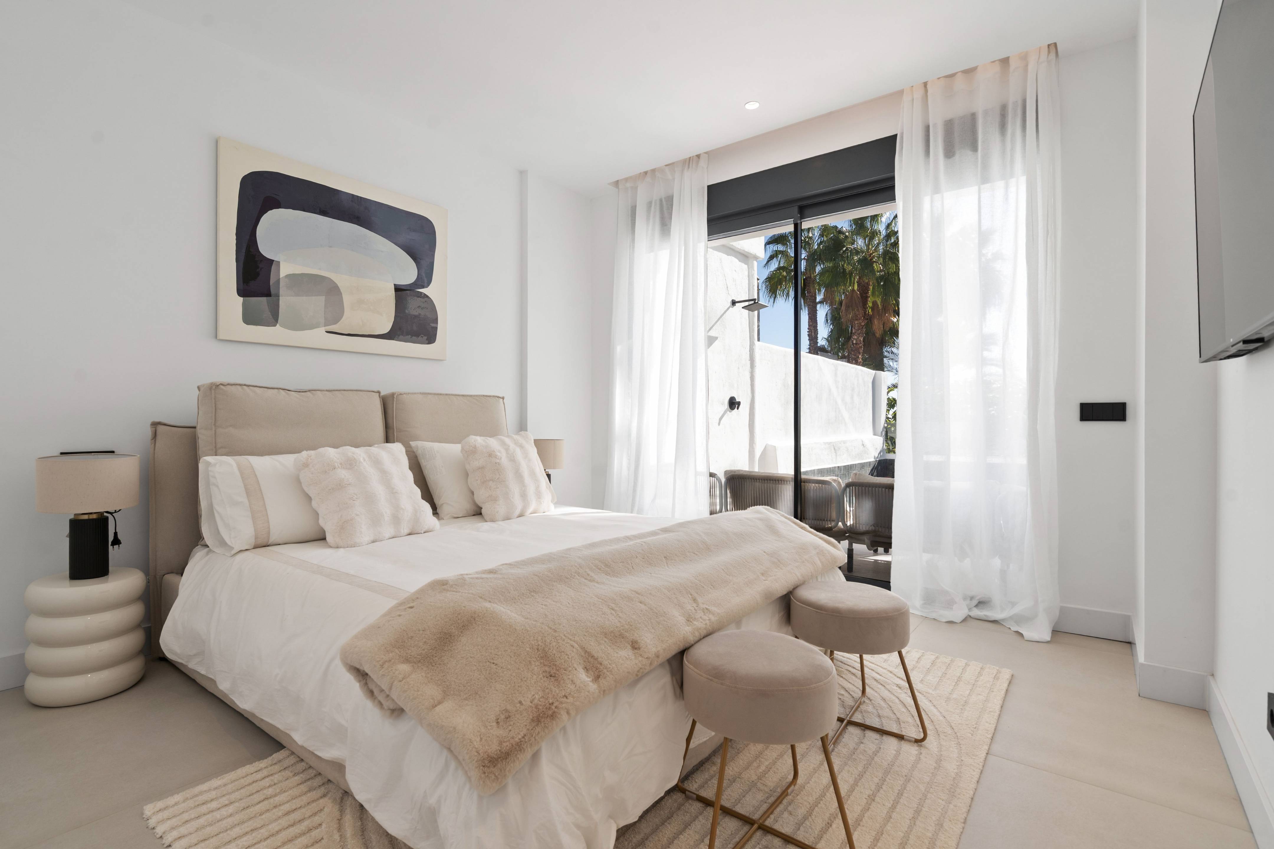 Bedroom with fitted wardrobes and external view in new-build penthouse, Paraiso-Barronal