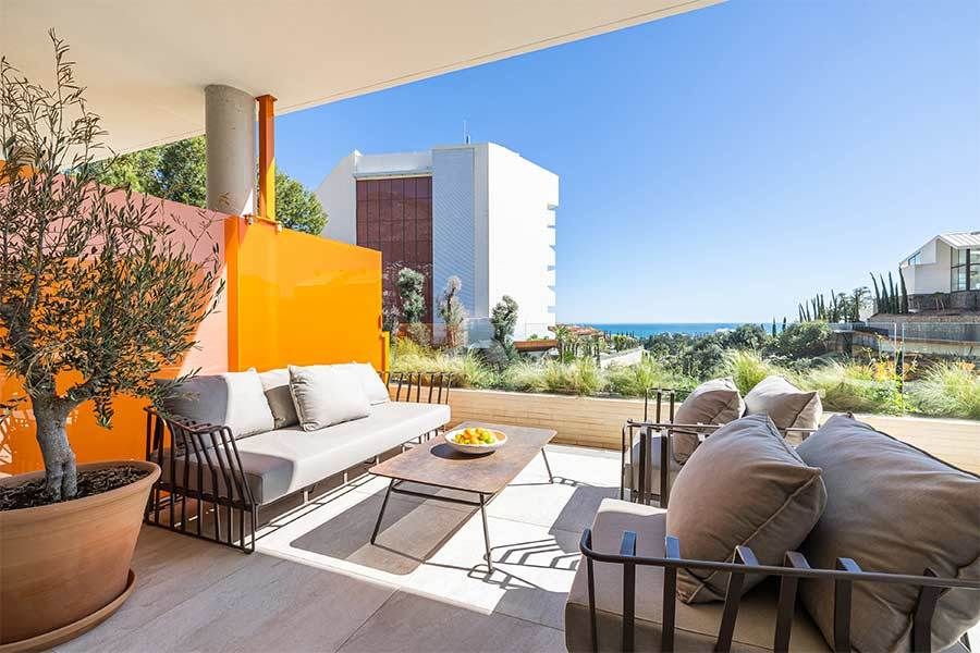 Covered terrace with outdoor seating in new-build villa, El Higuerón, Fuengirola
