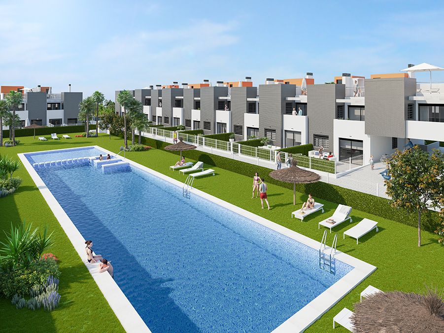 Communal pool and landscaped garden area of the Aguas Nuevas development