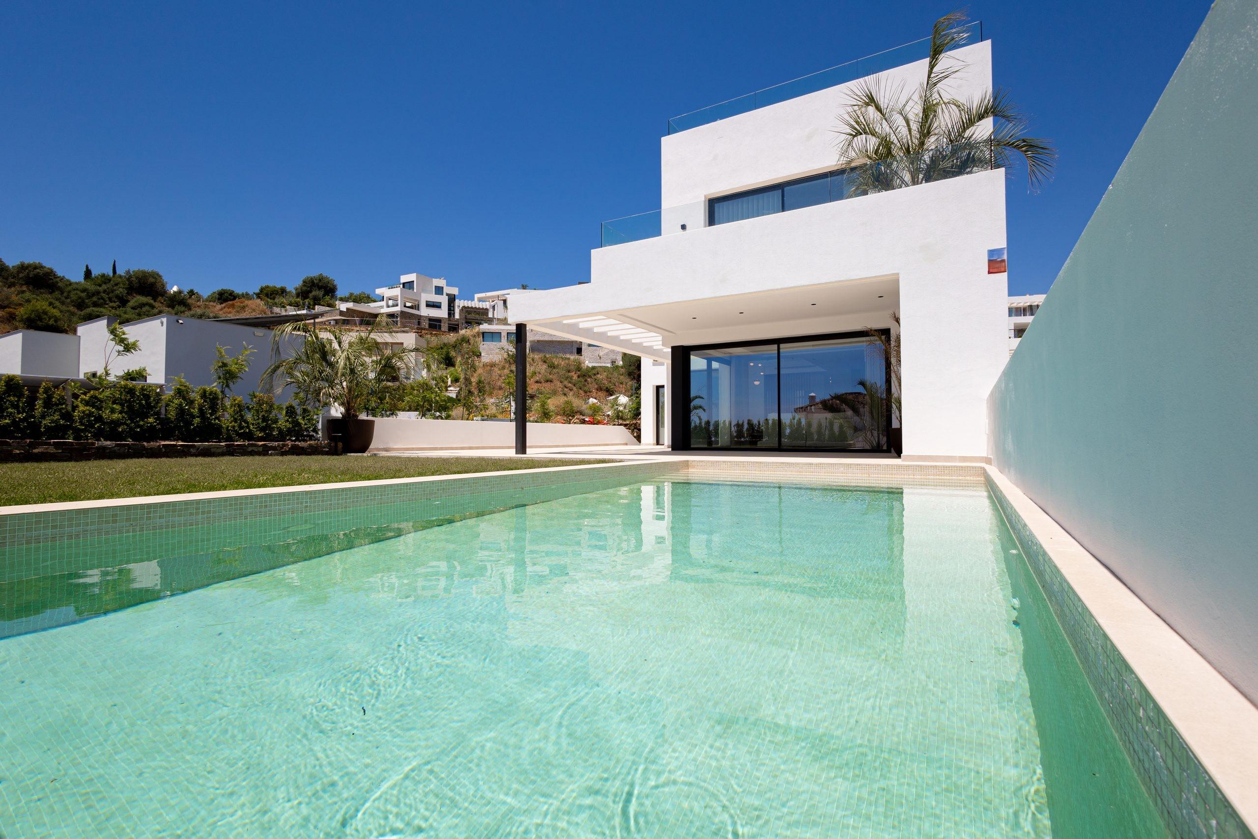 Exterior of new-build villa at dusk in Mijas Pueblo