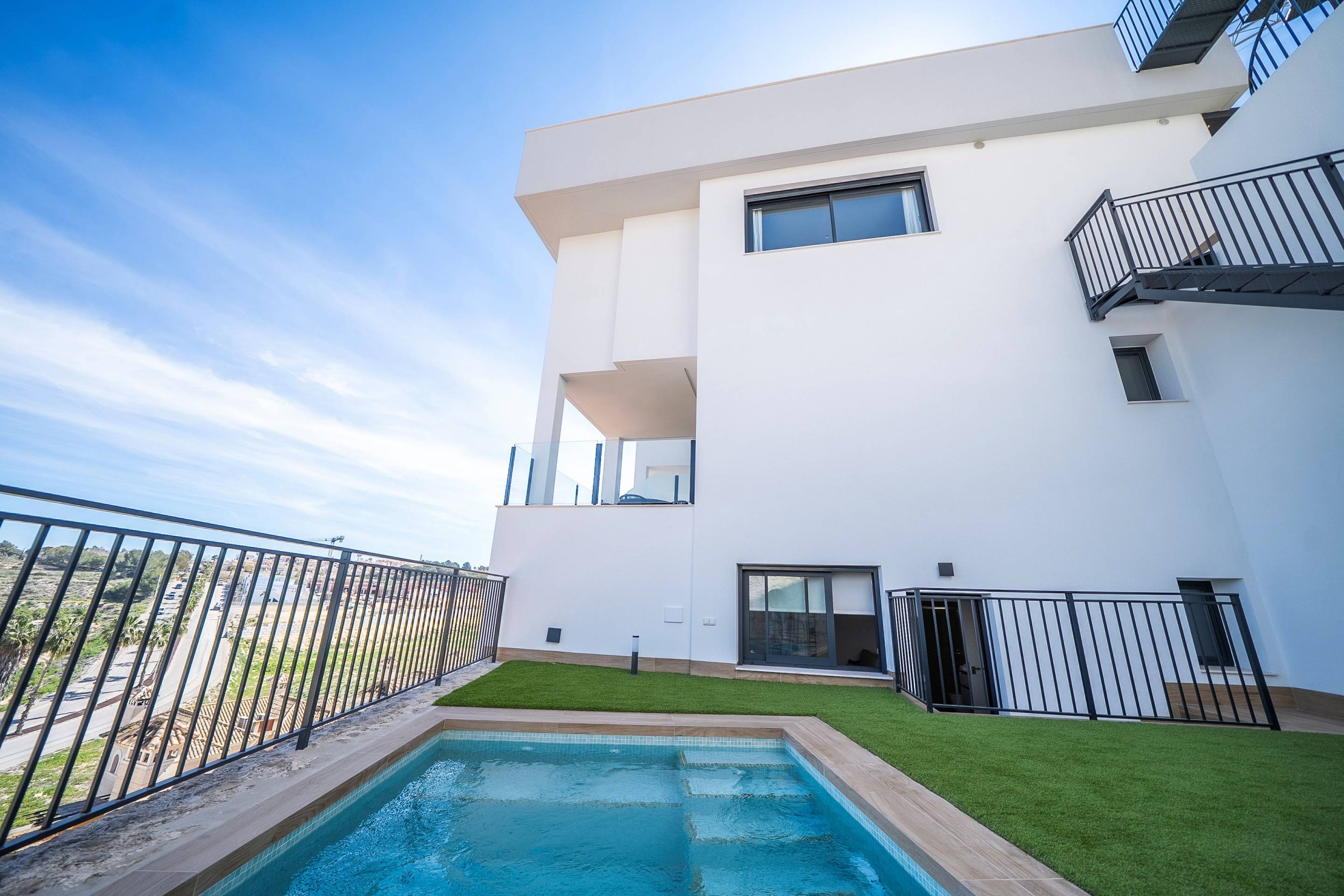 Entrance path and off-road parking area of new-build villa in Algorfa