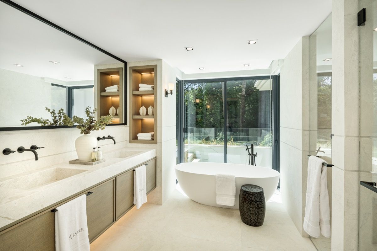 Night exterior of new-build villa with pool lighting, Puerto Banús, Marbella