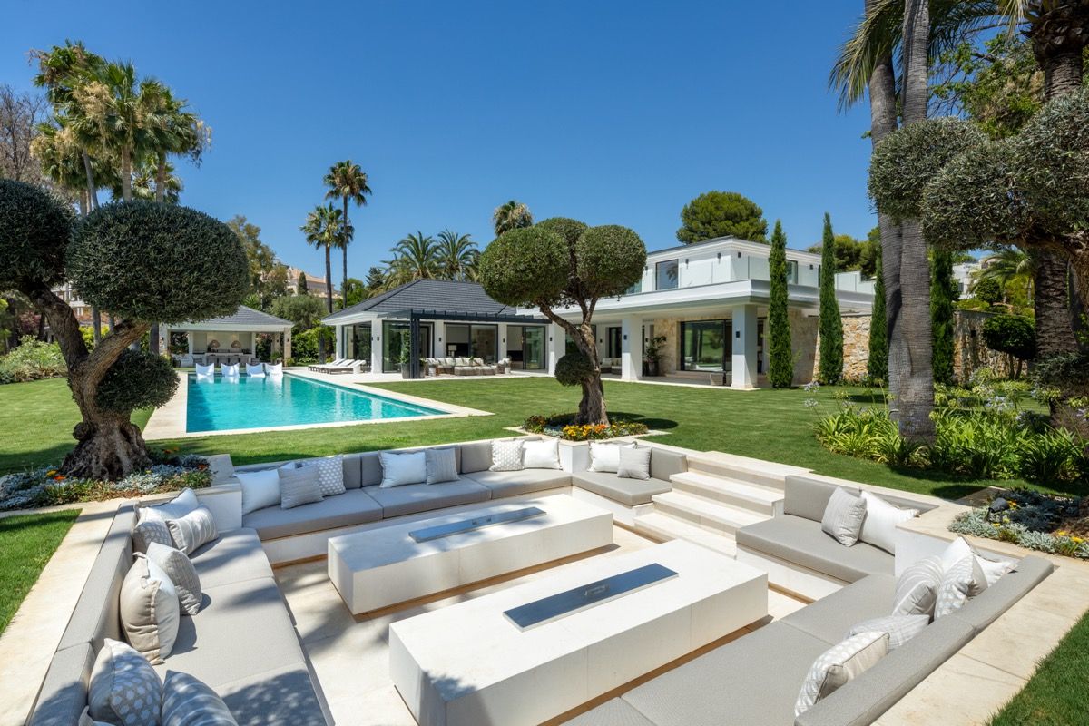 Open-plan living area with large glazed panels in 7-bedroom villa, Puerto Banús