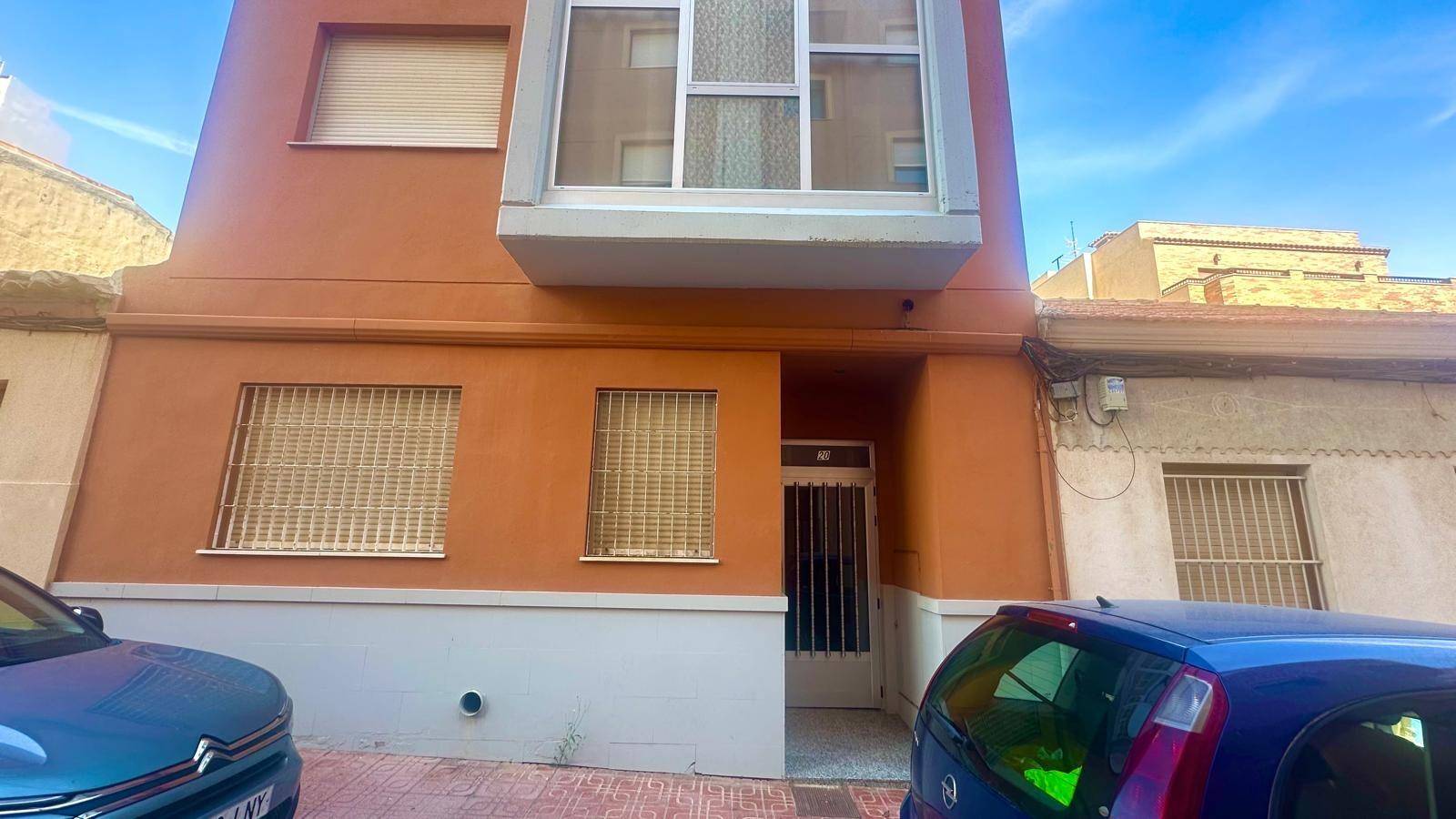 Living and dining area with south-facing window in 2-bedroom apartment, La Mata Pueblo