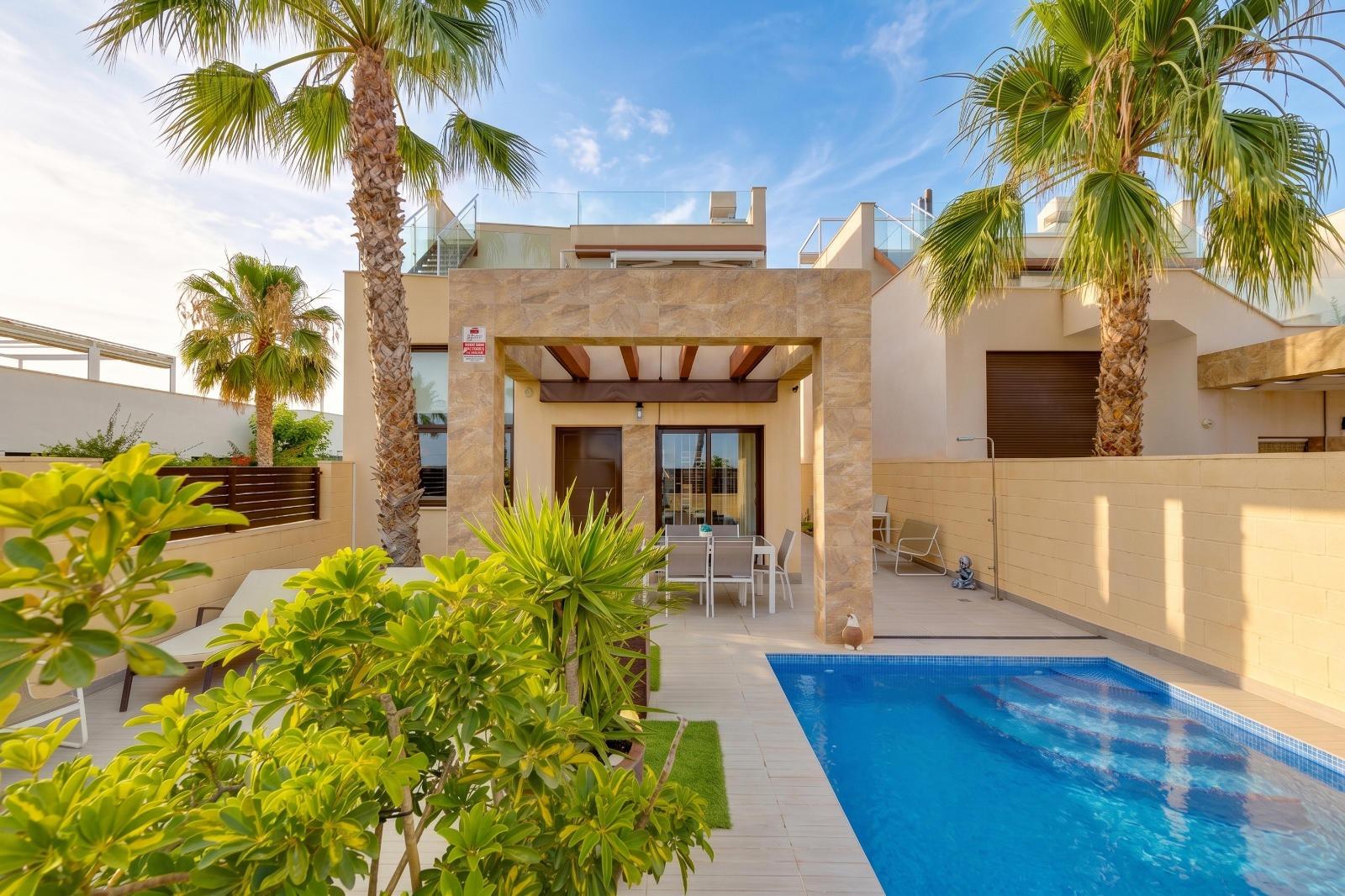 Rear garden and pool deck, villa in Pueblo Bravo, Ciudad Quesada